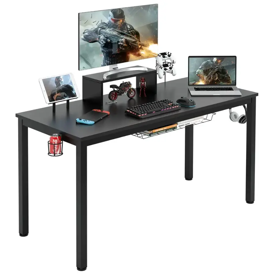 A black table with a keyboard, laptop, and other electronics on it.