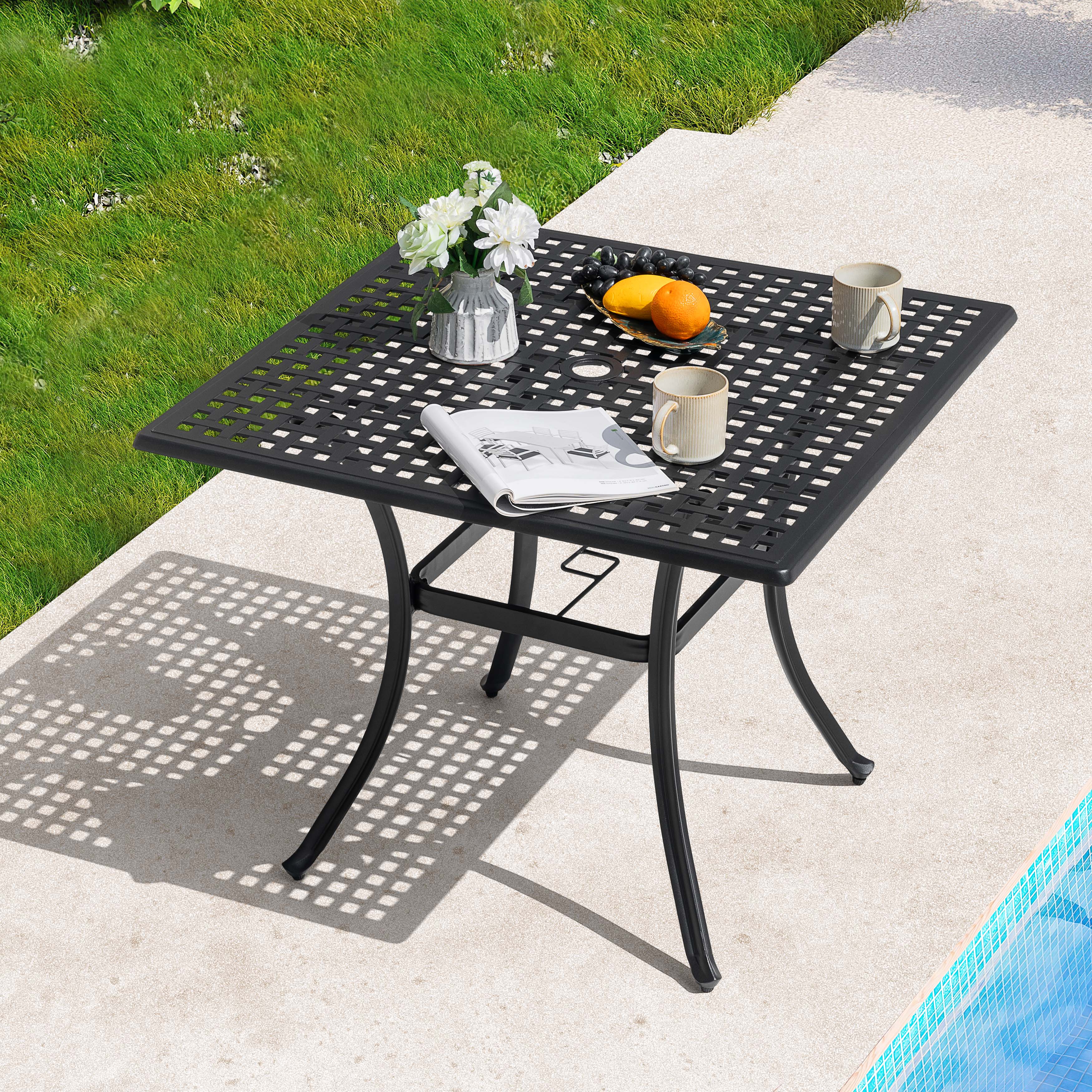 Angle. Nuu Garden - 35.4'' Square Cast Aluminum Outdoor Dining Table with Umbrella Hole and Mesh Tabletop - Black with Gold Speckles.