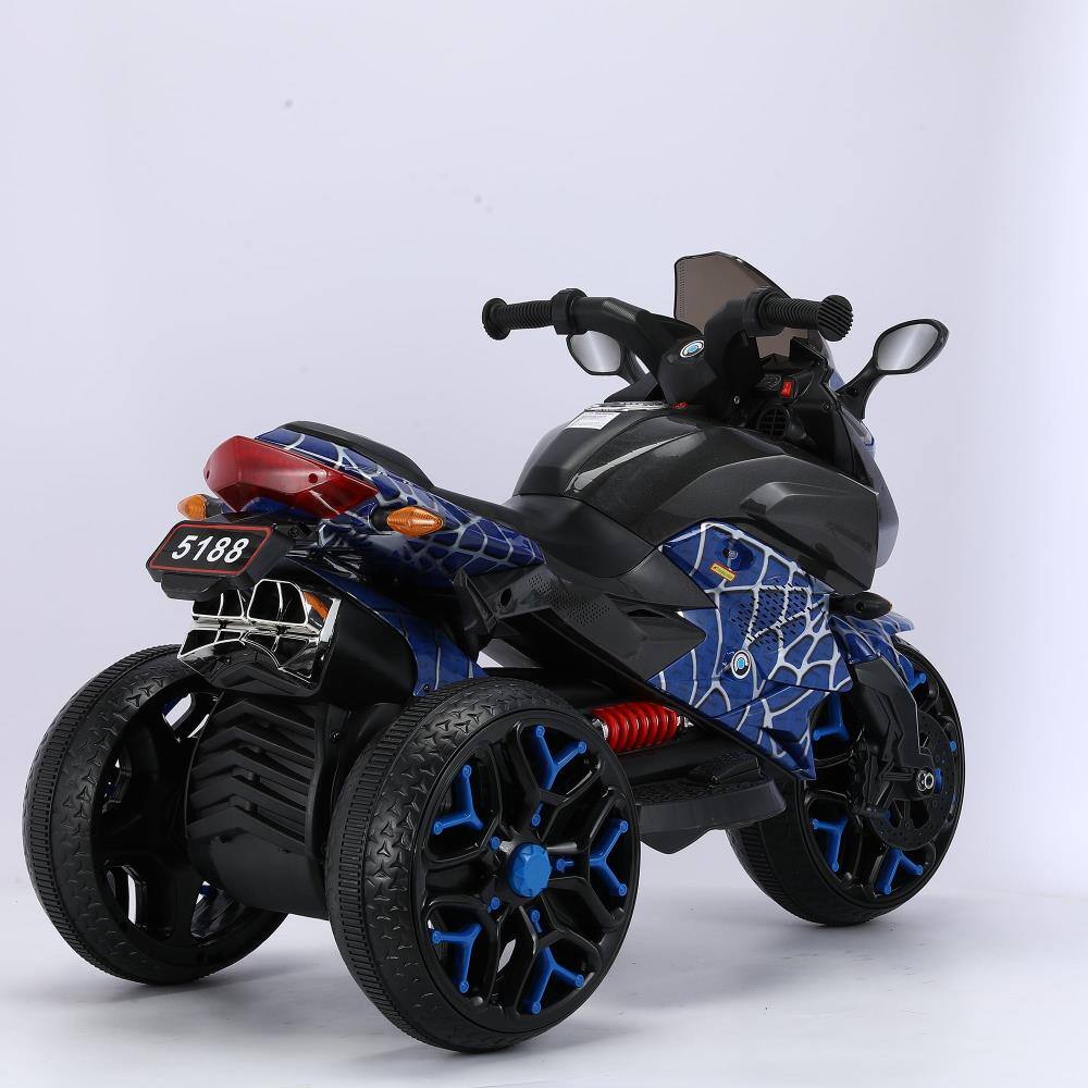 Angle. BreeBe - 12V Kids Electric Ride On Motorcycle Toy w/ Training Wheels, Manual Throttle, Hand Drive, Lights for Ages 3-6 - Blue.