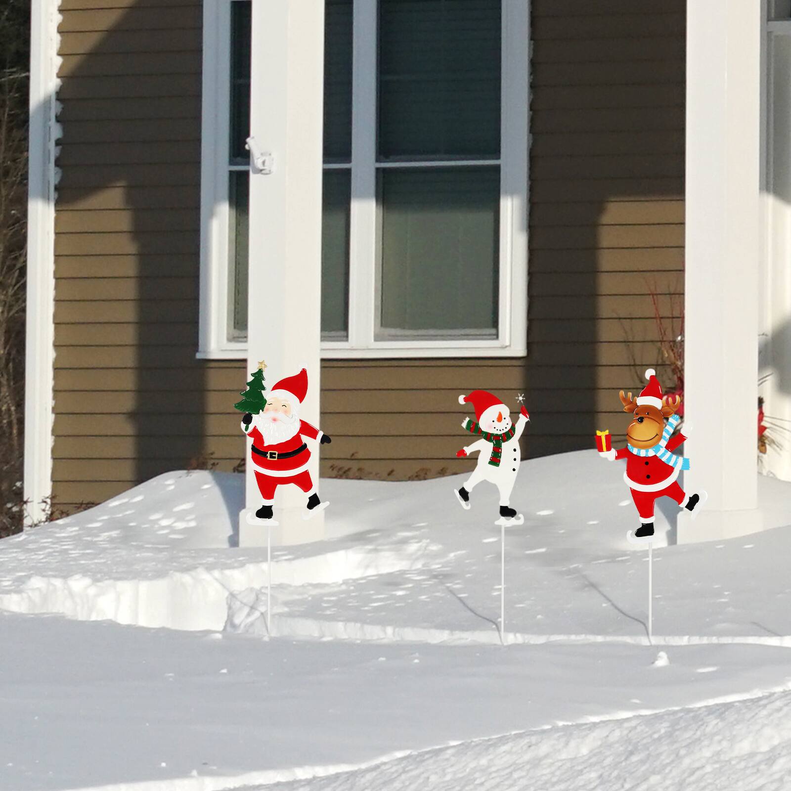 Front. Oumilen - 3‑Pack Christmas Skating Character Garden Stakes – Metal Signs with Santa, Snowman & Reindeer for Lawn Pathway.