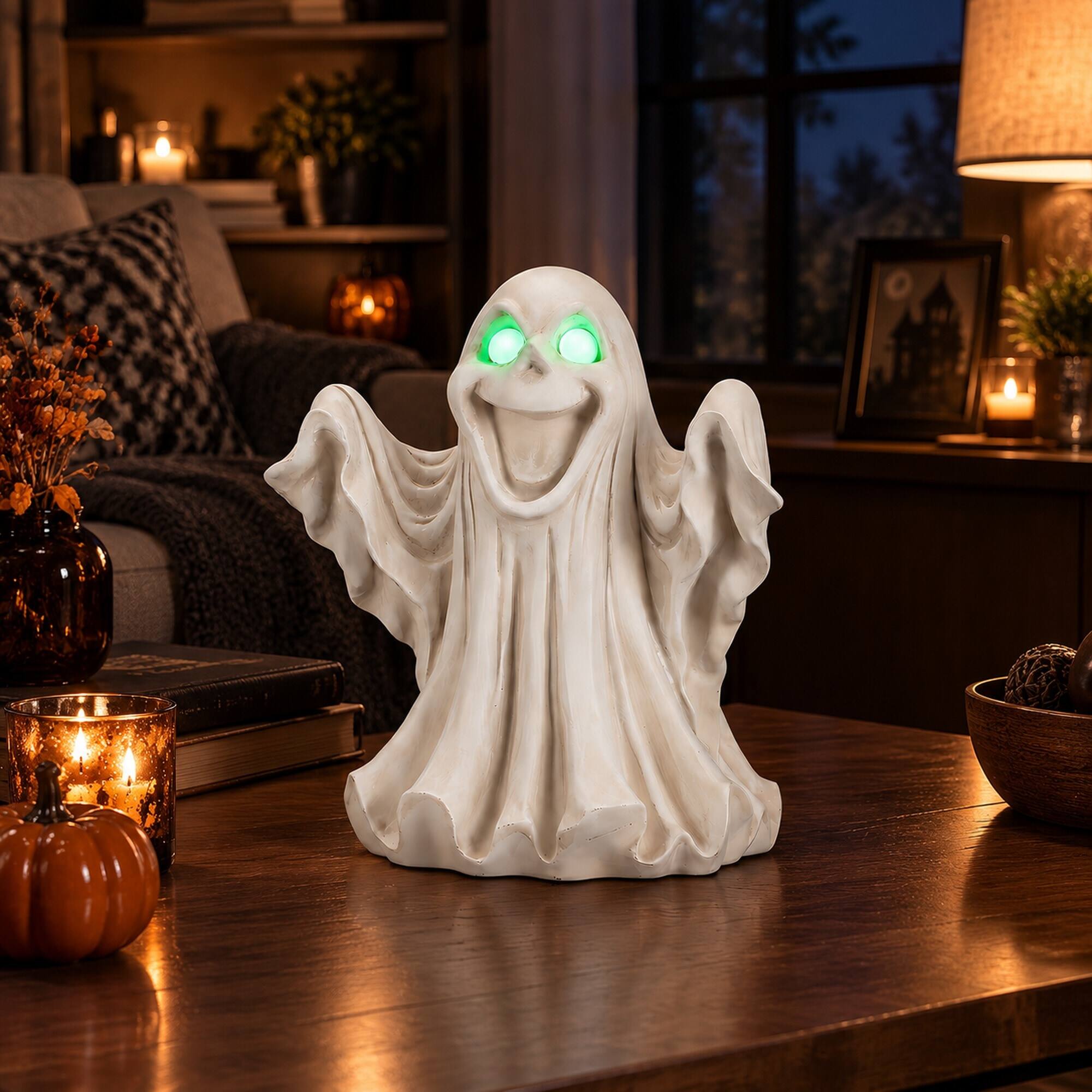 Left. RYHNUYNE - Halloween Ghost Figurine with Glowing LED Eyes for Spooky Home and Party Decor, Resin Tabletop Statue for Shelves - White.