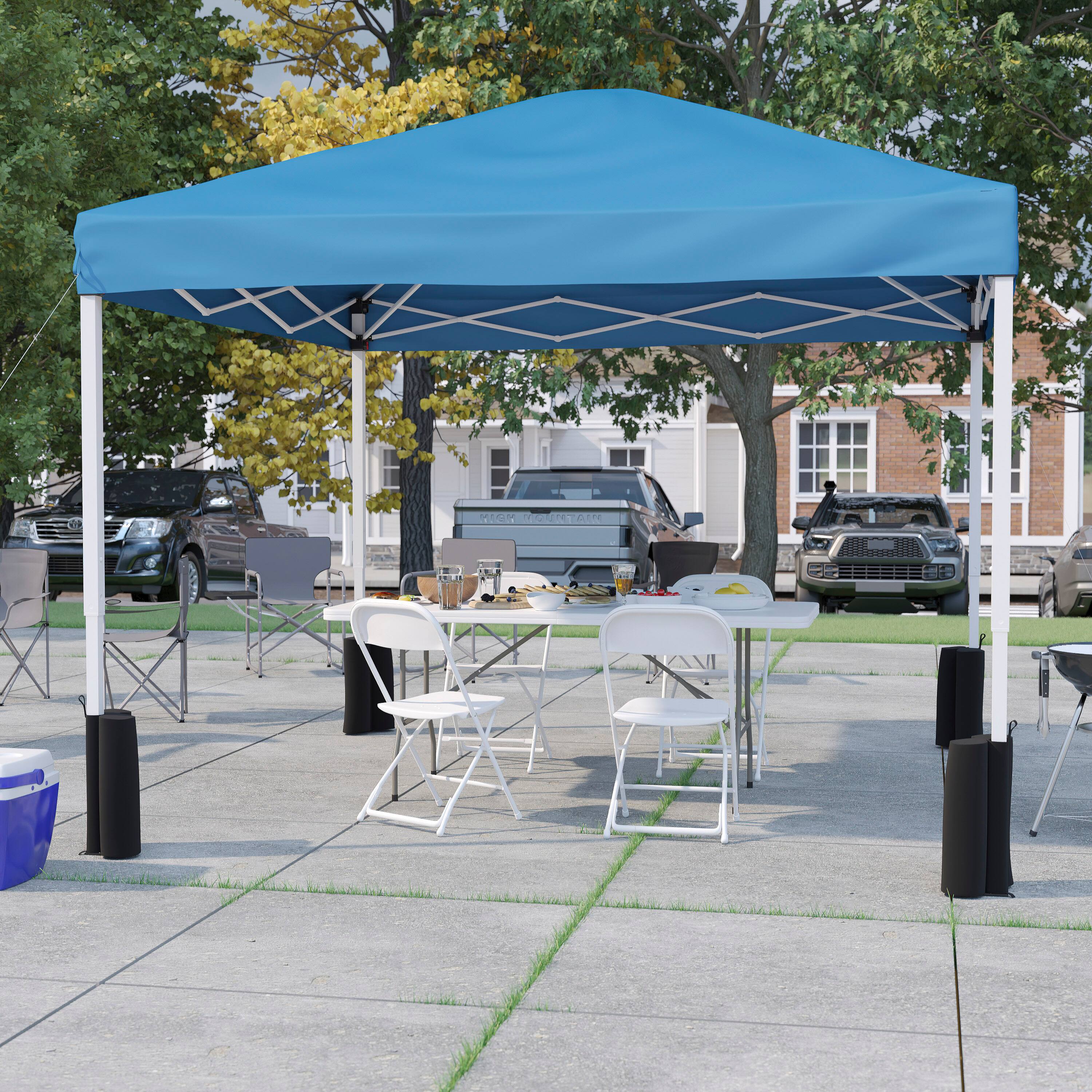 Angle. Flash Furniture - Otis Portable Tailgate/Event Tent Set-10'x10' Wheeled Blue Pop Up Canopy Tent, 6-Foot Bi-Fold Table, 4 White Folding Cha.