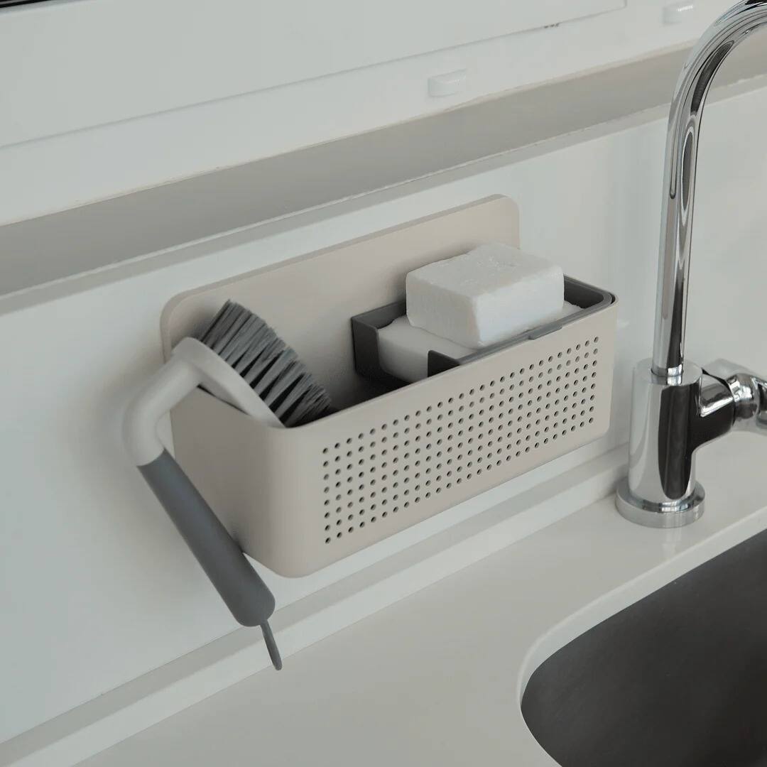 Left. OU - Kitchen Sink Organizer Set, Wall Mounted Caddy with Removable Sponge Tray & Scrub Brush.