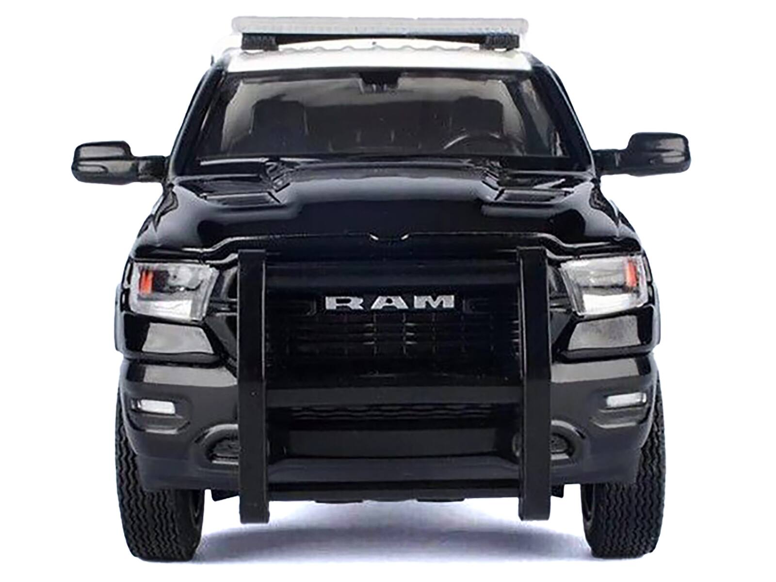 Left. Motormax - 2019 RAM 1500 Laramie Crew Cab Black & White "California Highway Patrol" Pickup with Camper 1/27 Law Enforcement Series - Black And White.