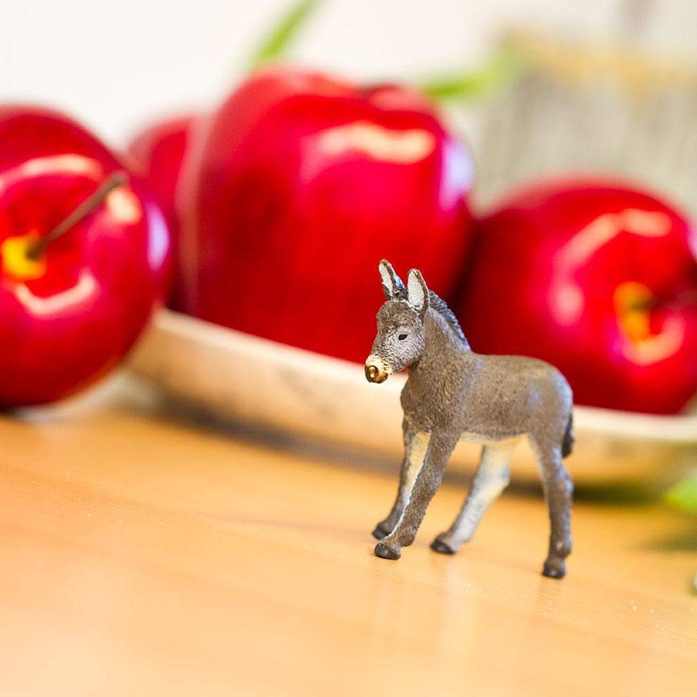 Angle. Safari Ltd. - Donkey Foal Toy Figurine.