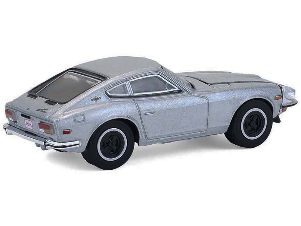 Left. Greenlight - 1970 Datsun 240Z Silver Metallic "Barrett-Jackson" Series 16 1/64 Diecast Model Car by Greenlight - Silver Metallic.