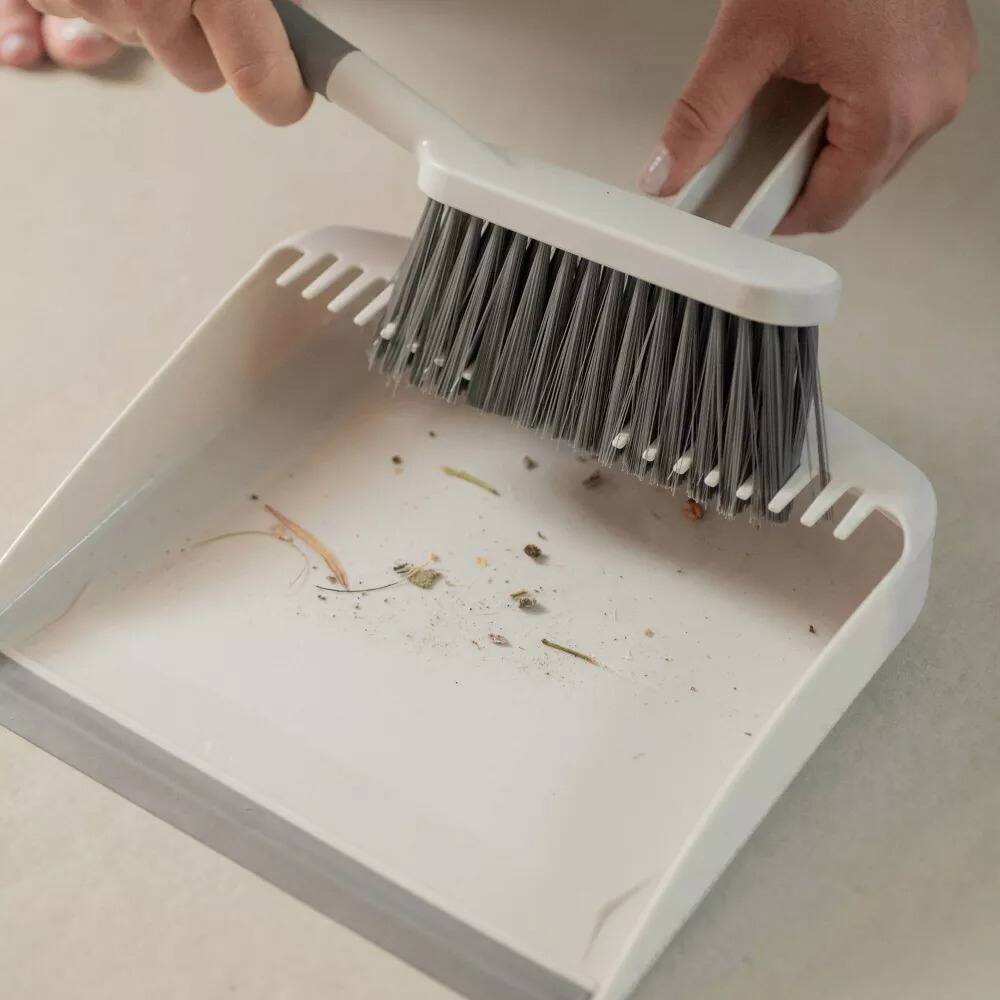 Left. OU - OU Flow Hand Broom with Dust Pan Set, Home Cleaning Brush and Dustpan Combo - White.