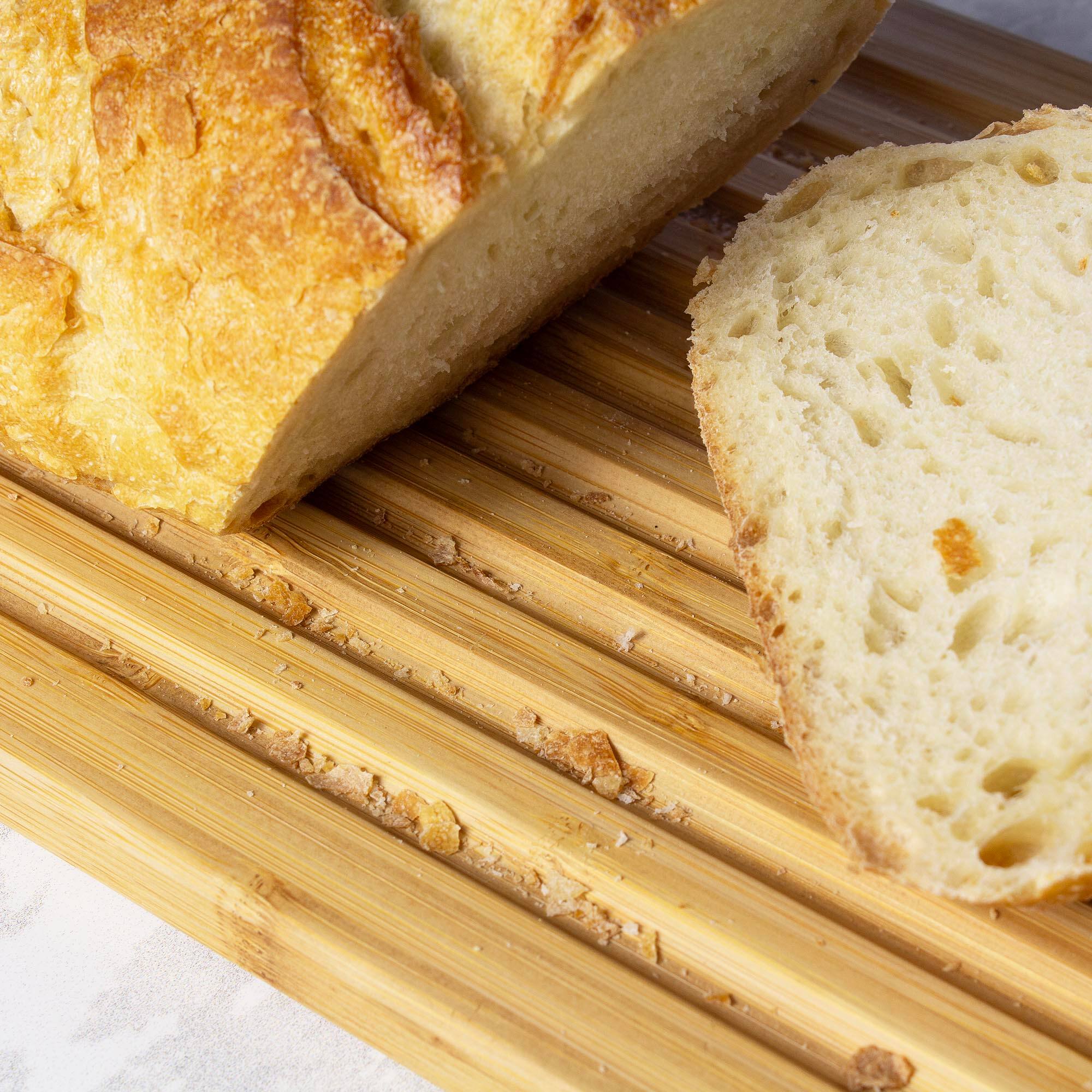 Left. Totally Bamboo - Bread Box with Removable Cutting Board Lid and Crumb Catcher.