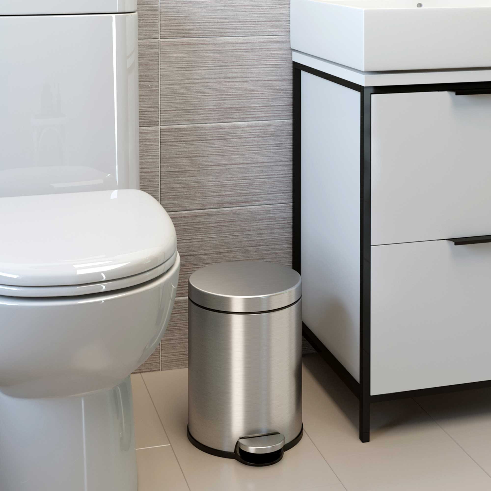Angle. iTouchless - 1.3 Gallon SoftStep Round Stainless Steel Step Bathroom Trash Can with AbsorbX Odor Filter - Silver.