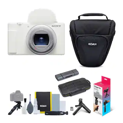 The image features a Sony camera and a KOAH vlogger kit. The camera is white and placed next to the black KOAH bag. The kit includes various accessories such as a tripod, a microphone, a lens cap, a cleaning cloth, and a strap. These items are arranged in a visually appealing manner, showcasing the different components of the vlogger kit.