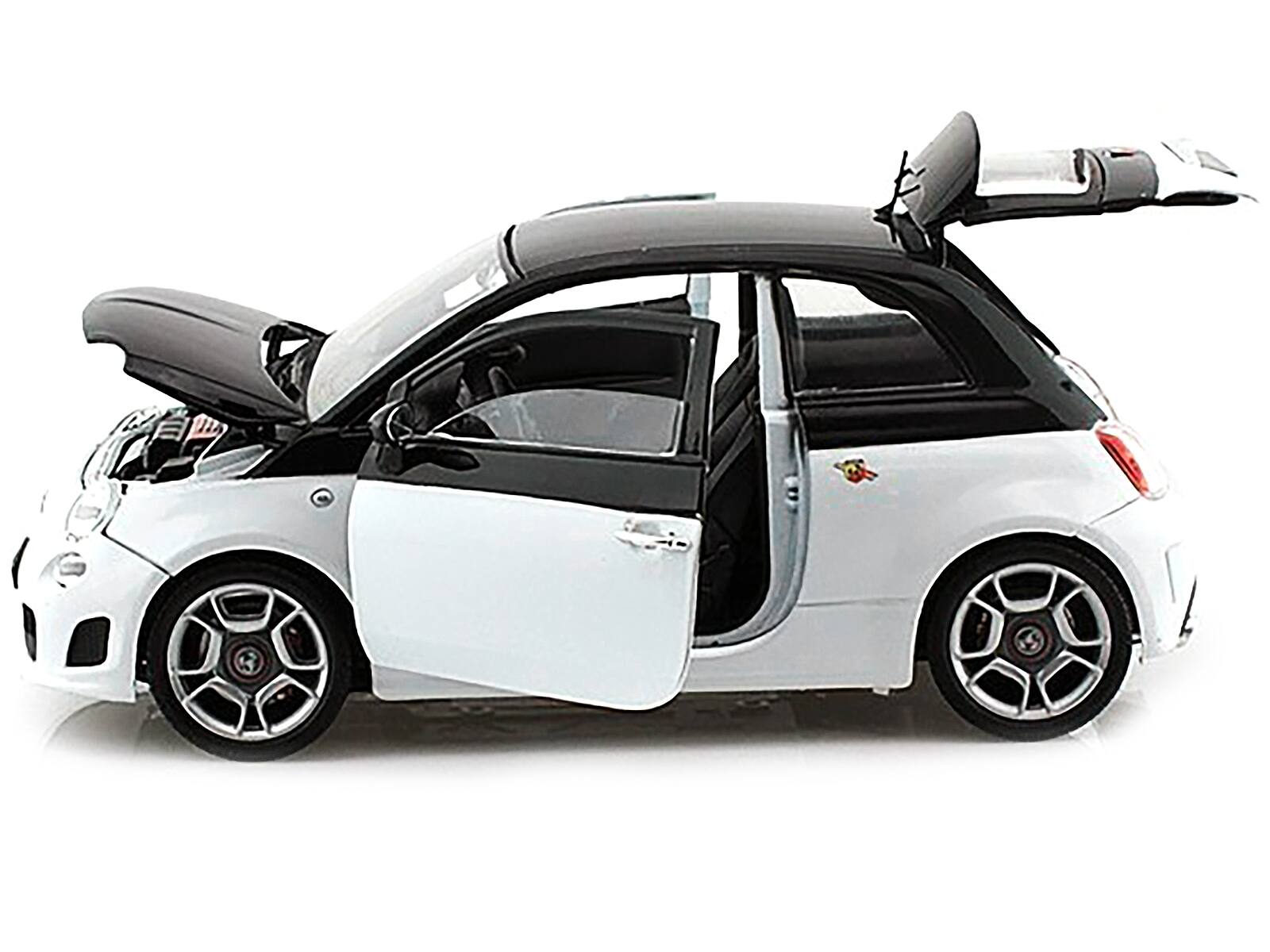 Left. Motormax - Fiat Abarth 500 White and Black 1/18 Diecast Model Car by Motormax - White and Black.