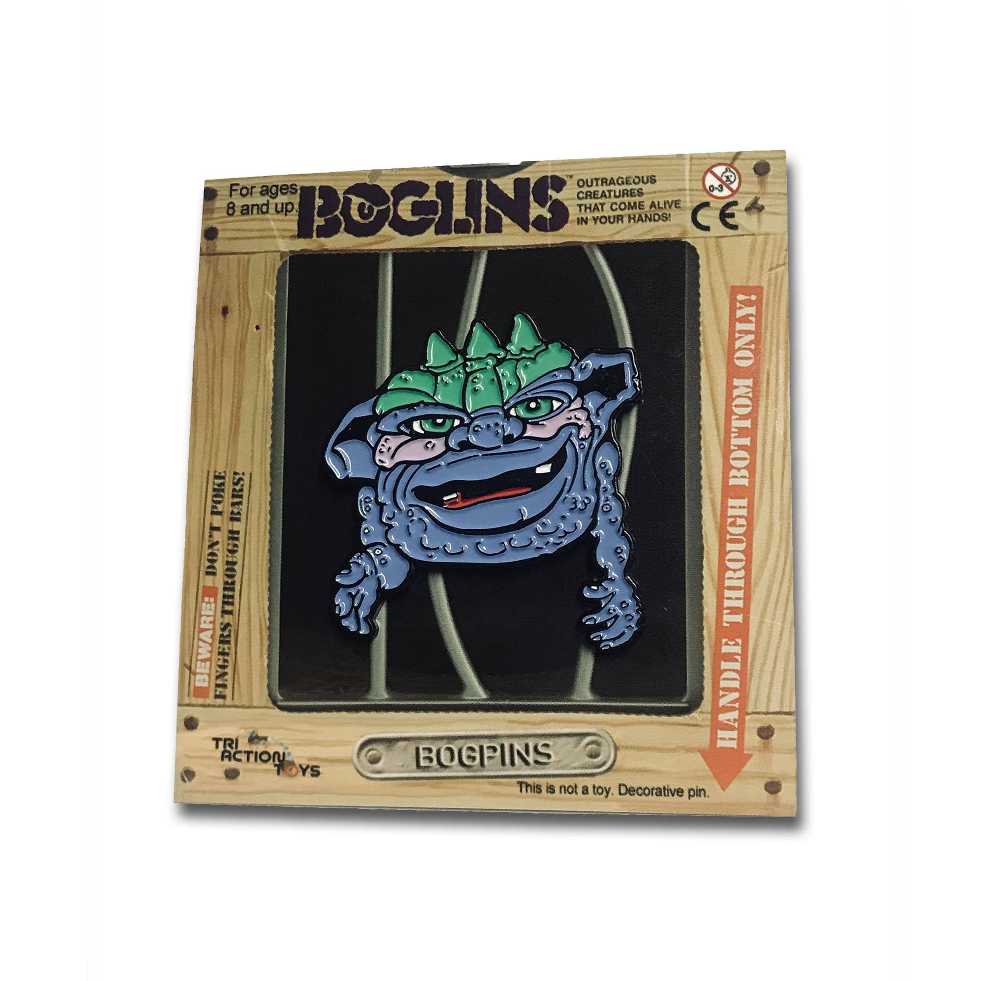 OUTRAGEOUS CREATURES THAT COME ALIVE IN YOUR HANDS!  
For ages 8 and up  
BOTTOM POKE BARS!  
DON'T THROUGH THROUGH BEWARE: BE FINGERS TRI HANDLE ACTION BOGEINS  
This is not a toy. Decorative pin.  
CE ONLY!