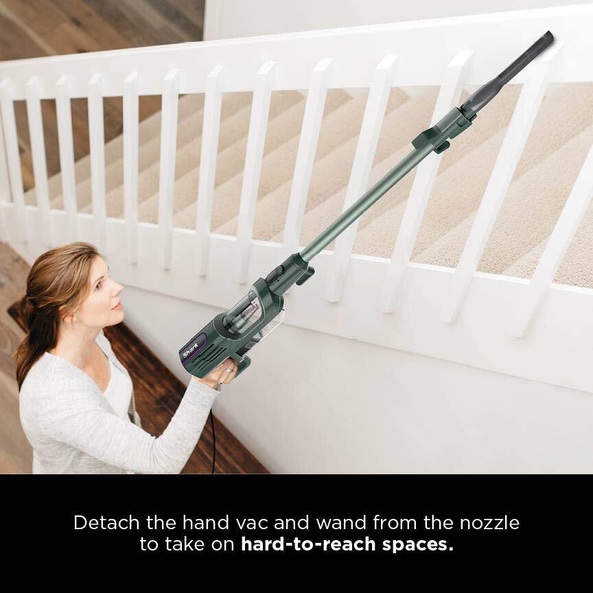 Detach the hand vac and wand from the nozzle to take on hard-to-reach spaces.