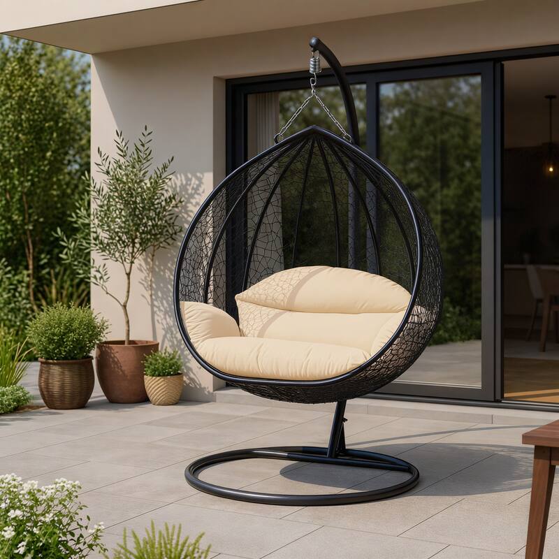 Angle. LeisureMod - Recluse Modern Wicker Teardrop Hanging Egg Chair with Stand - Outdoor Indoor Swing Chair & Cushion - Cream.
