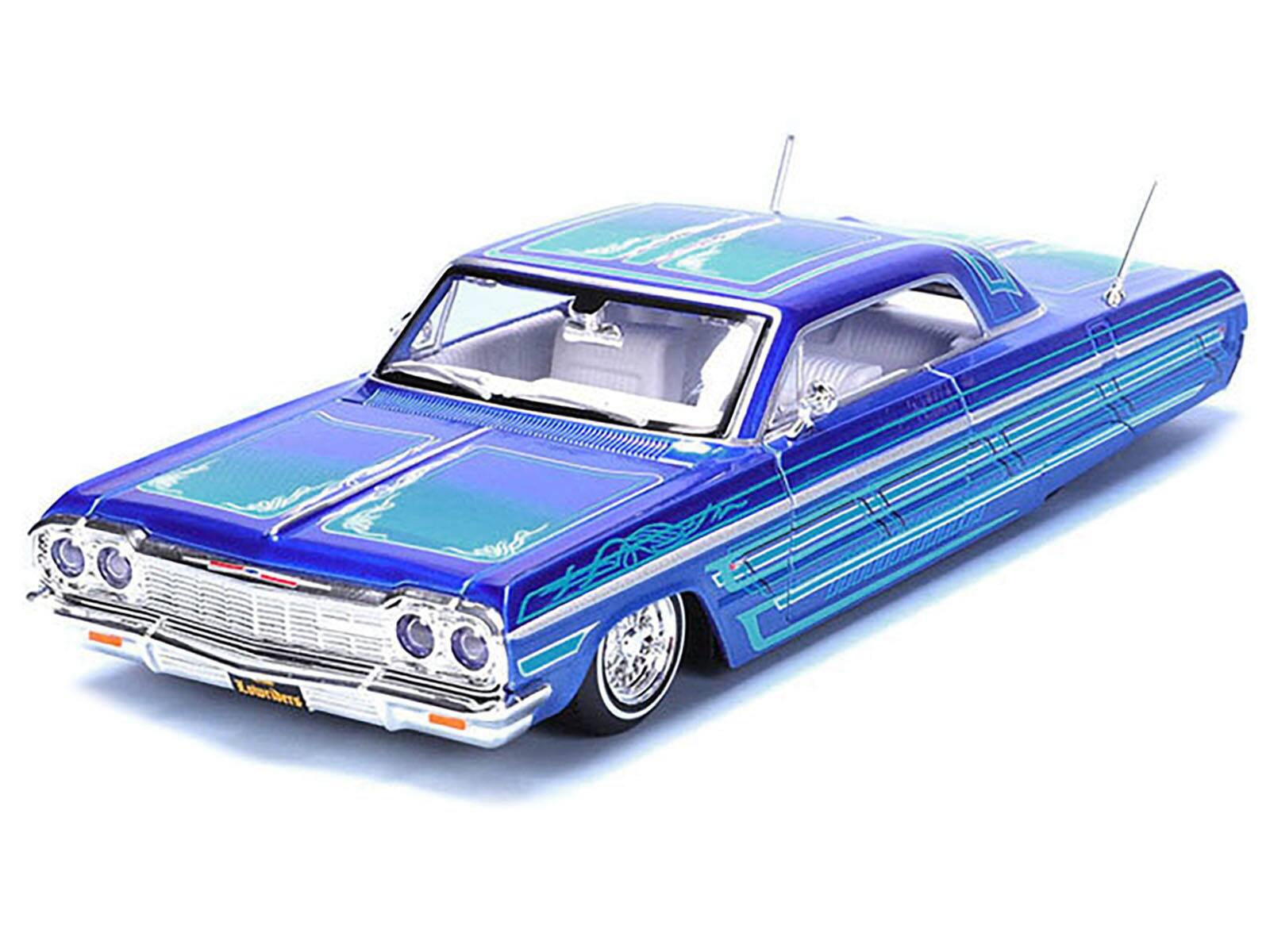 Angle. Maisto - 1964 Chevrolet Impala SS Lowrider Candy Blue with Graphics and White Interior "Lowriders" "Maisto Design" Series 1/26 - Candy Blue and White.
