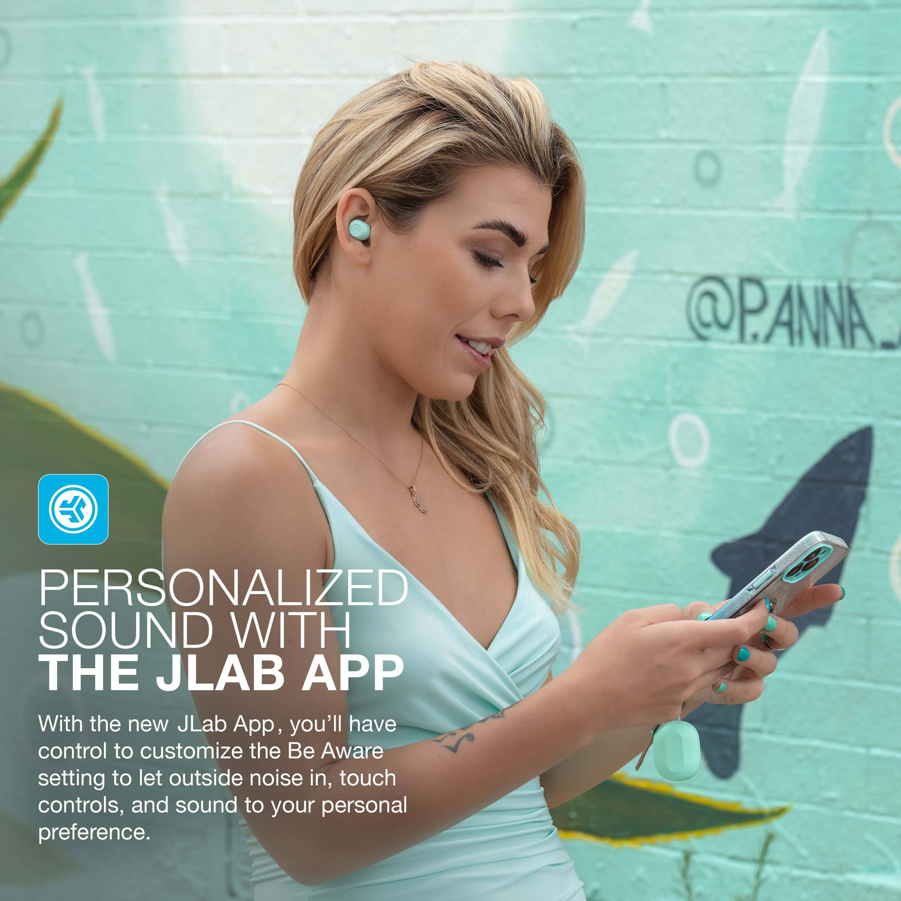 The text on the image reads: "Personalized sound with the JLab App." This text is grouped and corrected to read: "With the new JLab App, you'll have control to customize the Be Aware setting to let outside noise in, touch controls, and sound to your personal preference."