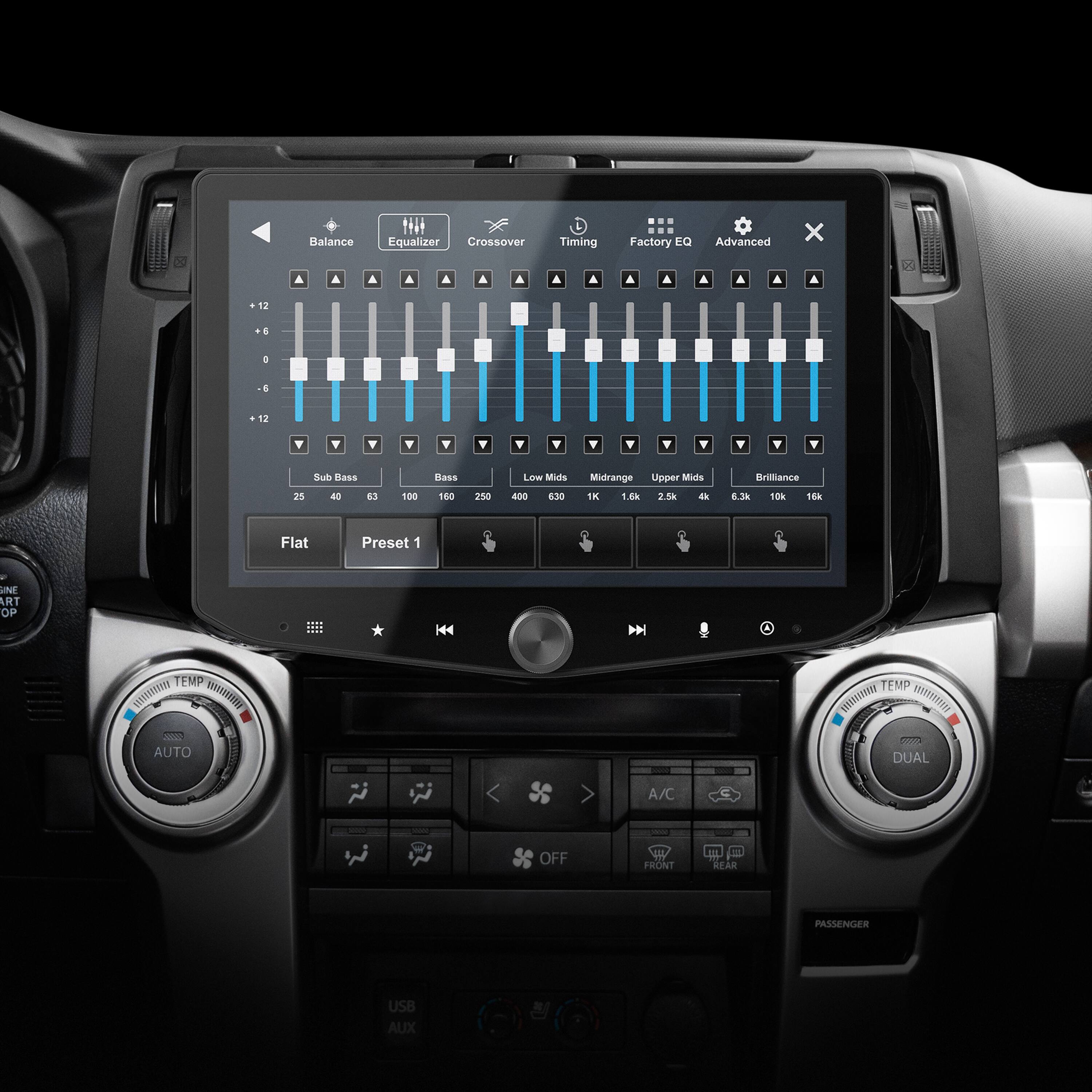 The image shows a car's dashboard with a display screen featuring a graphic equalizer. The display screen also has a balance equalizer, crossover timing, and factory EQ settings. The screen is divided into different sections, including a subwoofer, mids, and upper mids. Additionally, there are preset options for the user to choose from, such as Flat, Art, and Auto. The display screen also shows the current temperature and whether the air conditioning is on or off for both the front and rear passenger areas. There is also a USB and AUX option for connecting external devices.