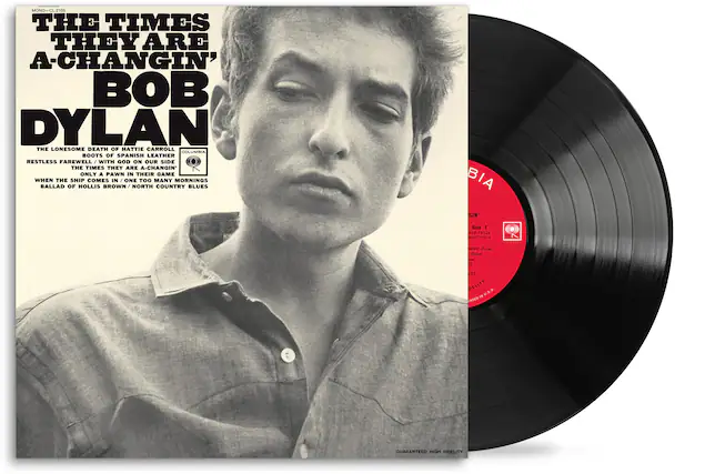 **MONO C H105**
**THE TIMES THEY ARE A-CHANGIN'**
**BOB DYLAN**
**THE LONESOME DEATH OF HATTIE CARROLL**
**BOOTS OF SPANISH LEATHER**
**RESTLESS FAREWELL**
**WITH GOD ON OUR SIDE**
**THE TIMES THEY ARE A-CHANGIN'**
**ONLY A PAWN IN THEIR GAME**
**WHEN THE SHIP COMES IN**
**ONE TOO MANY MORNINGS**
**BALLAD OF HOLLIS BROWN / NORTH COUNTRY BLUES**
**COLUMBIA**
**Side 1**
**KLP 71524**
**MNA RUN -ytion Oylon - i**
**JES DELITY S.A & - INTEO GUARANTEED HIGH FIDELITY**
**Side 1**
**LP 75526**
**GIN* Dylan**
**3**
**DEL1177**
**MADE IN U.S.A.**