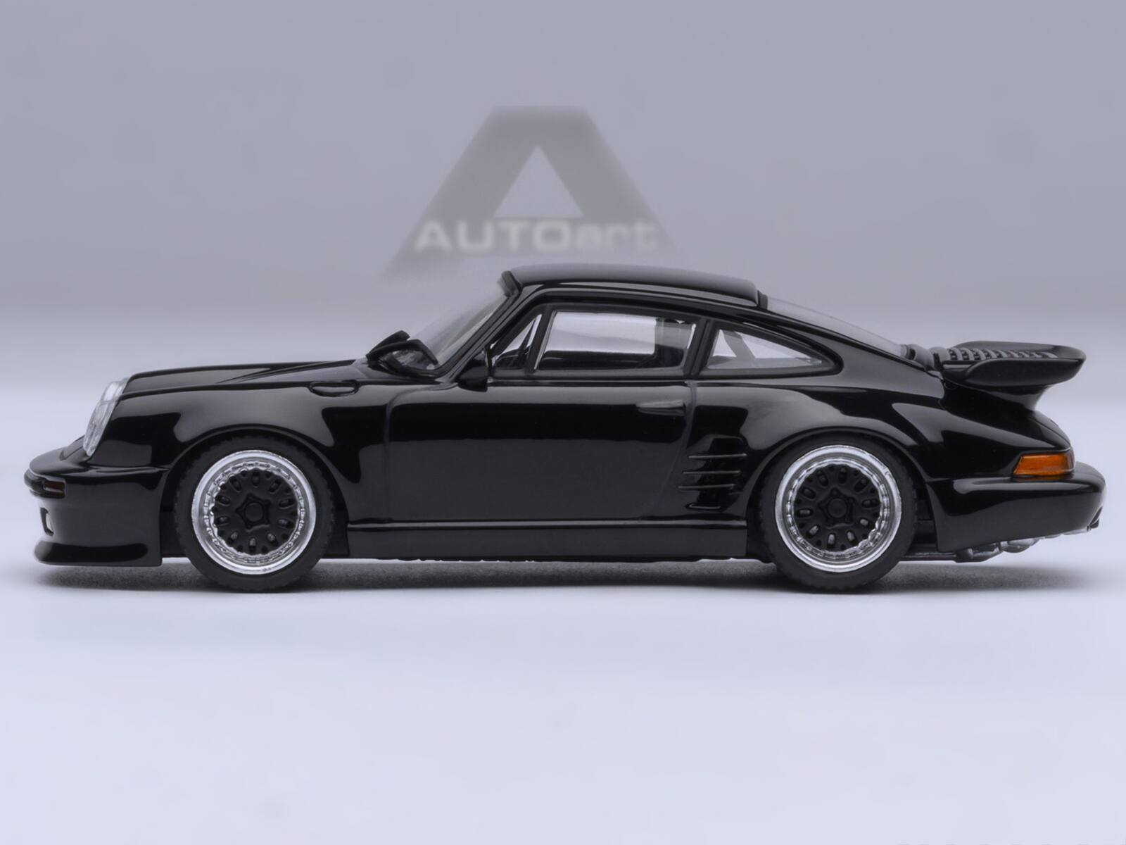 Angle. Autoart - Porsche 911 (930) Turbo "Blackbird" Black "Wangan Midnight - Comic #1 Version" Manga 1/64 Model Car by Autoart - Black.