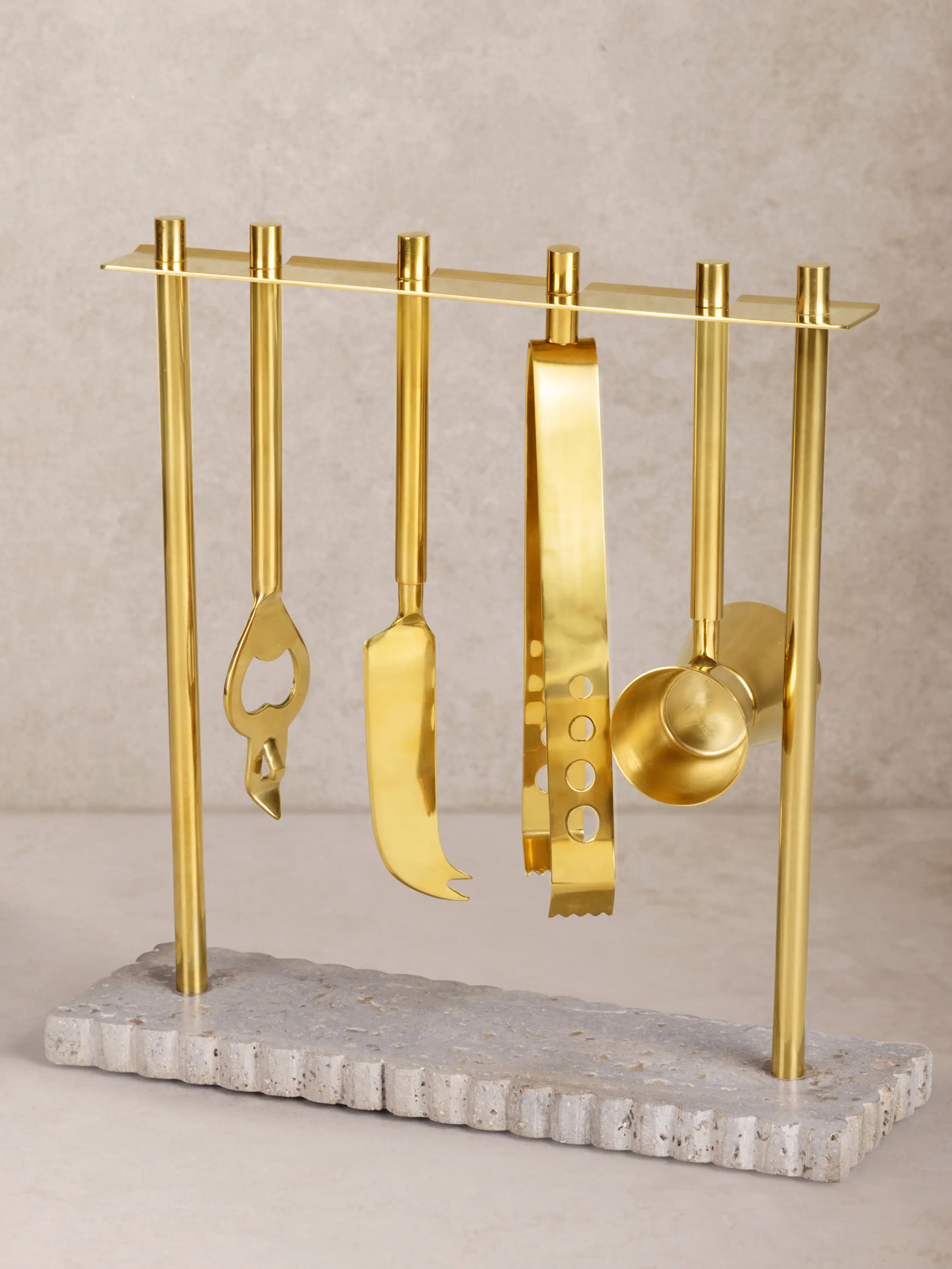 Front. GAURI KOHLI - Jubel Bar Tools - Shades of brown gray with gold.