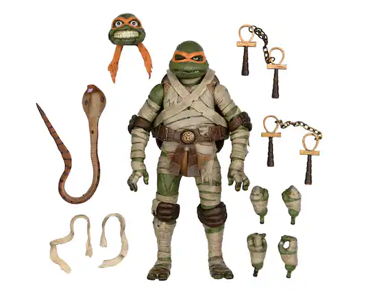 Front. NECA - Universal Monsters/Teenage Mutant Ninja Turtles 7” Scale Action Figure - Michelangelo as The Mummy.