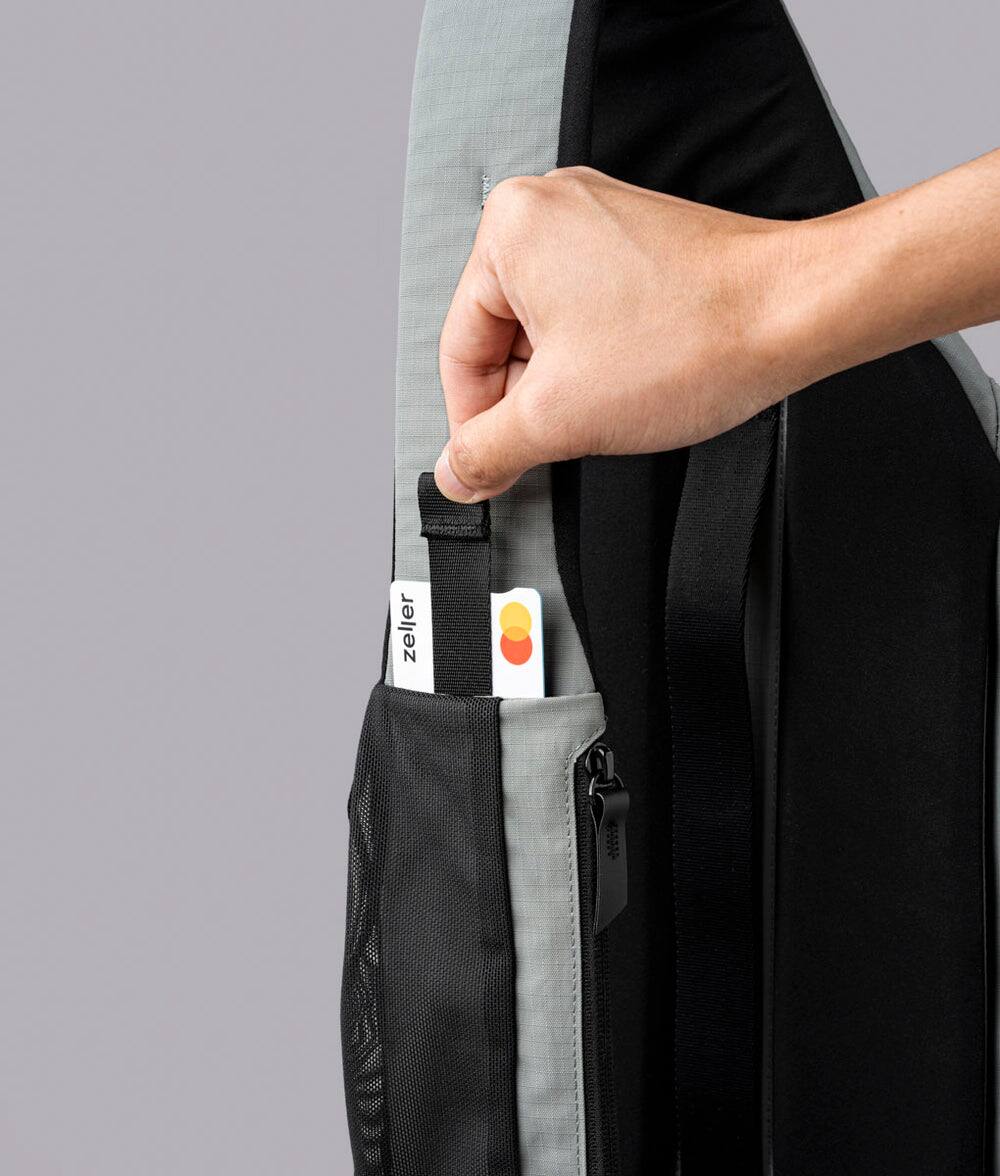 Alt View 5. ALPAKA - Crossbody Sling Bag 7.5L (Right Shoulder) for Men, Fits 11" Tablet, Phone Sleeve, Bottle Pocket, Luggage Pass-Through - Grey Axoflux 210D.
