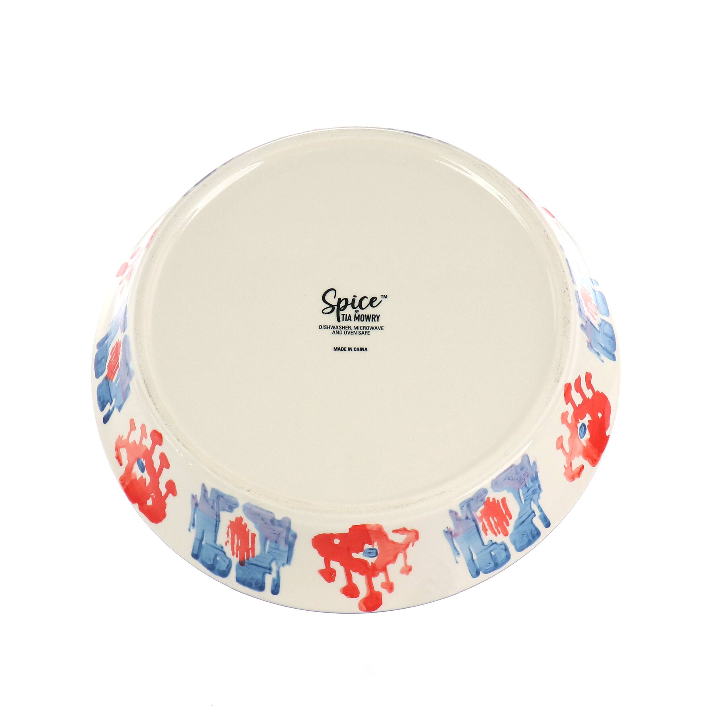 The image features a white bowl with a blue and red floral design, which is labeled "Spice." The bowl is placed on a white background, making it stand out.