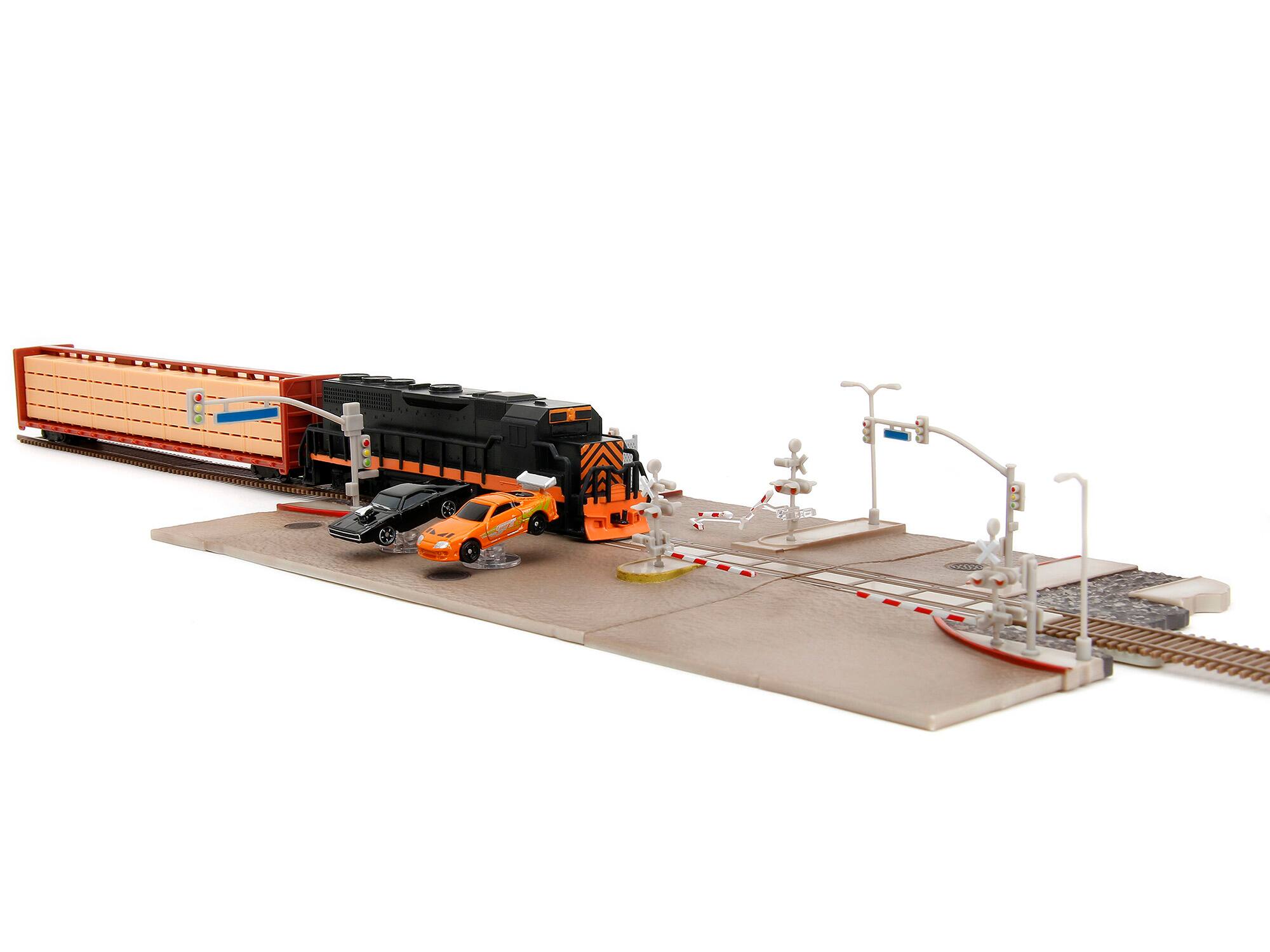 Left. Jada - "Fast & Furious" Final Race Diorama with Toyota Supra Orange and Dodge Charger Black "Nano Scene" Series model by Jada - Supra Orange And Black.