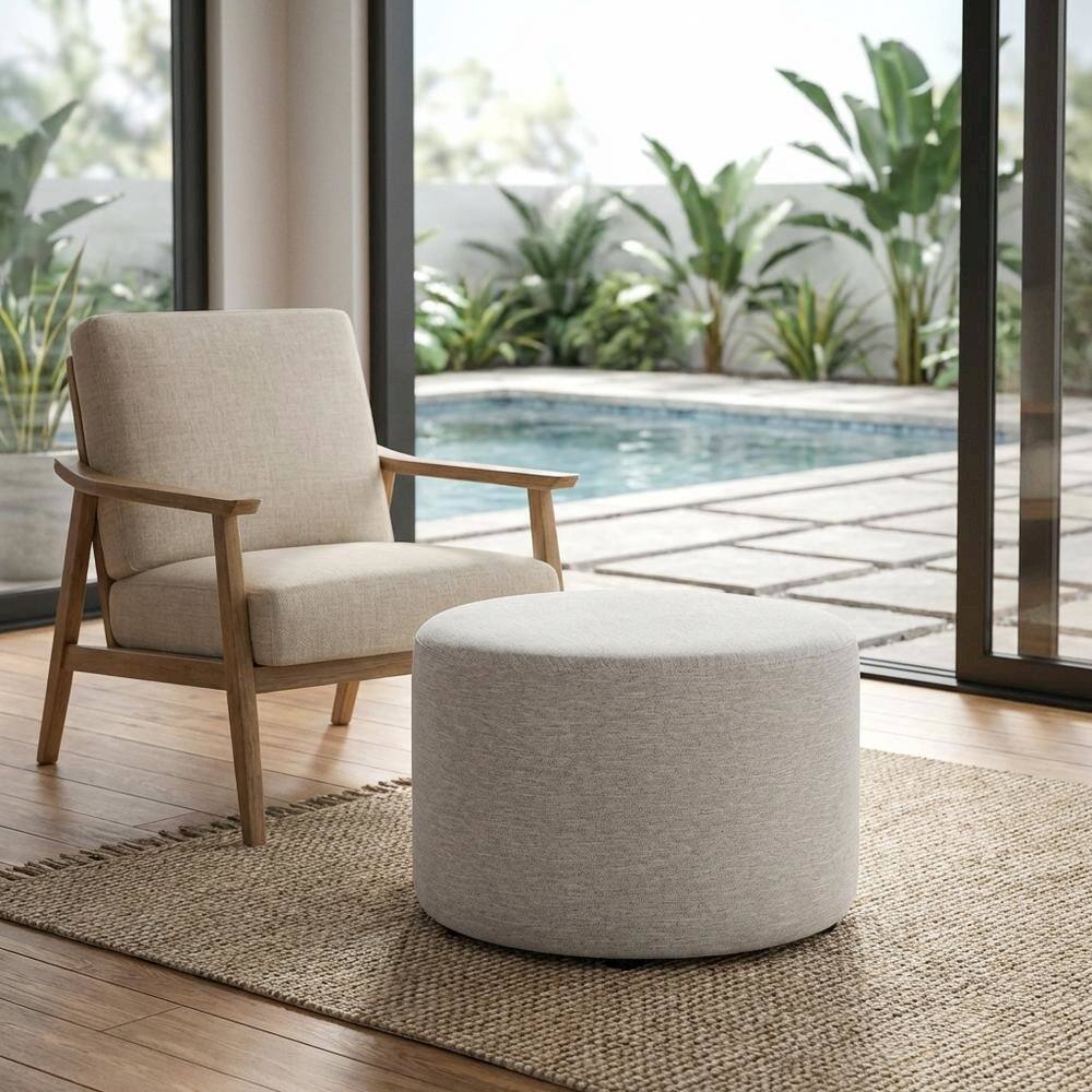 Left. Outdoor Escape - Round Heathered Fabric Upholstered Ottoman, neutral tones, comfortable seating - Gray.