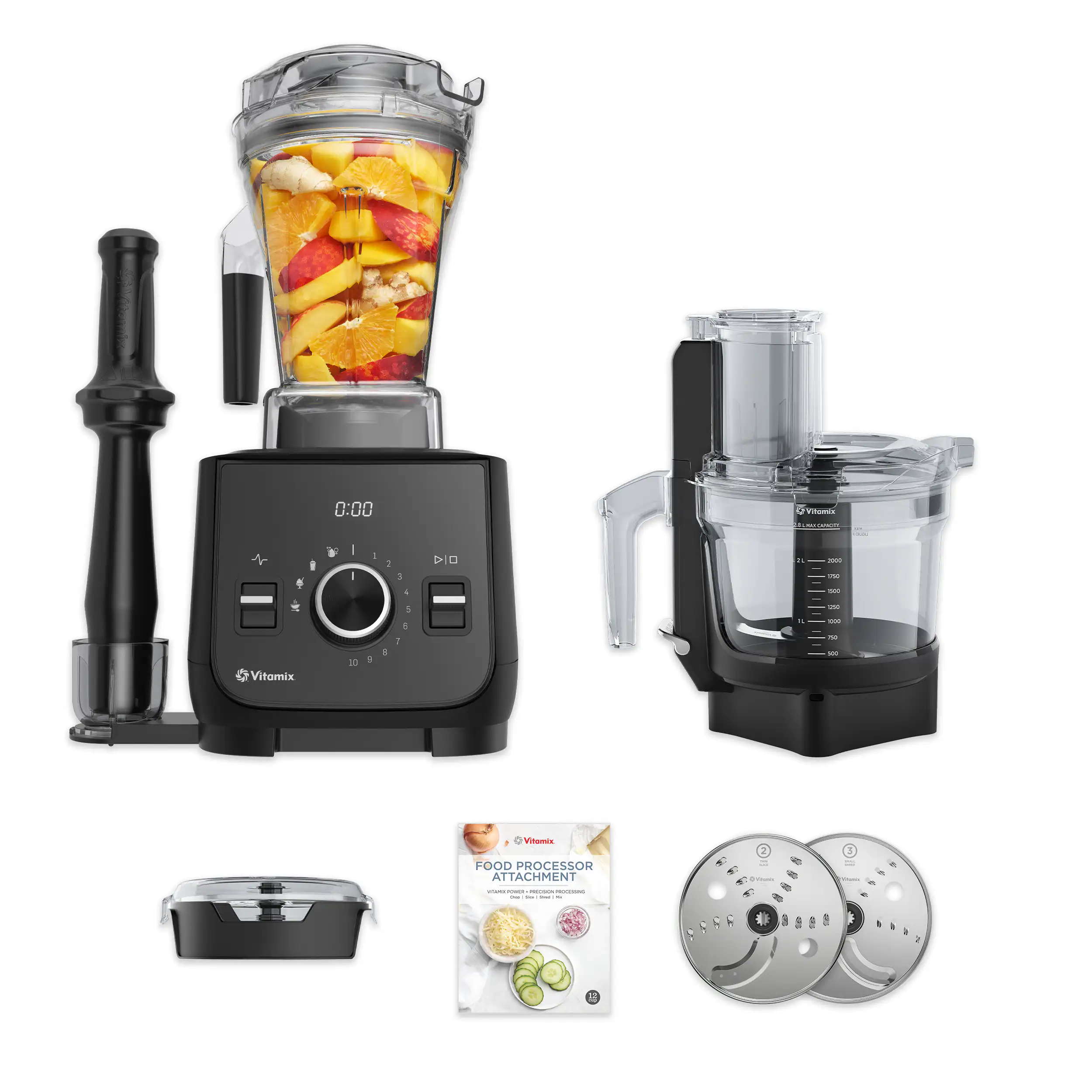 The image features a Vitamix food processor with various attachments, including a food processor attachment. The food processor is placed on top of a counter, and there is a booklet nearby, possibly providing instructions or recipes. Additionally, there is a blender in the scene, which can be used for making smoothies or other blended beverages. The image also showcases a bowl of fruit, including bananas, oranges, and apples, which can be used as ingredients for the food processor or blender.