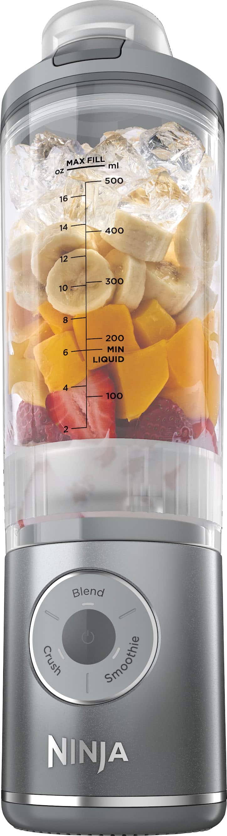 The image shows a Ninja blender with various fruits and vegetables inside. The blender is filled with a mixture of fruits and vegetables, including bananas, apples, and oranges. The blender is designed to crush and blend the ingredients together, creating a smoothie or other blended beverage. The blender is filled to the MAX FILL level, which is 500 ml or 16 oz. The image also shows the blender's settings, including Blend, Crush, and Smoothie.