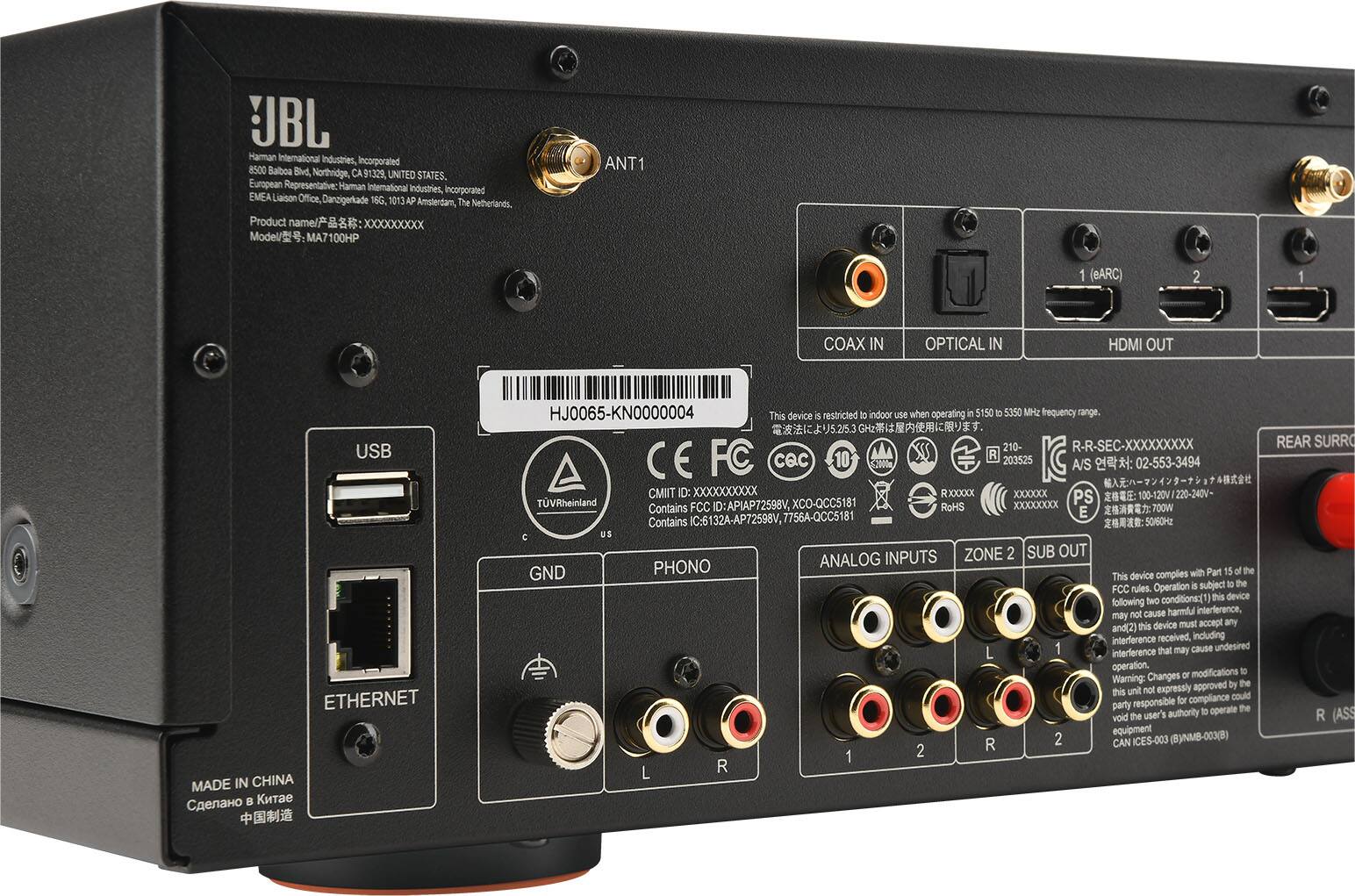 The text on the image reads:
"JBL Haman international industries incorporated 8500 Balboa Blvd, Northridge, CA 91329, UNITED STATES. European Representative Haman international Industries, incorporated EMEA Liaison Office, Danzigerade 16G 1013AP The Amsterdam, Netherlands. Product name/? : XXXXXXXXx Model/: MA7100HP ANT1 1 (BARC) 2 1 COAX IN OPTICAL IN HDMI OUT USB ETHERNET MADE IN CHINA HJ0065-KN0000004 This device S restricted to indoor use when operating in the 5150 D 5350 MH2 frequency range. 5.25.3 210- R-R-SEC-XXXXXXXXX FC CQc 10 R 203525 CE A/S : 02-553-3494 CMIT Dc XXXXXXXXXX RXXXXX XXXXXx PS TVRheinland FCC ID: APIAP72598V, XCO-QCC5181 RoHS XXXXXXXXxX Contains E 7OOW Contains IC-6132A-AP72598V, 7756A-QCC5181 5060 C US INPUTS ZONE 2 SUB OUT PHONO ANALOG GND complies with Part 15 of the FCC rules. conditions: this device may cause harmful interference to radio and television reception, and this device must accept any interference, including interference that may cause undesired operation."