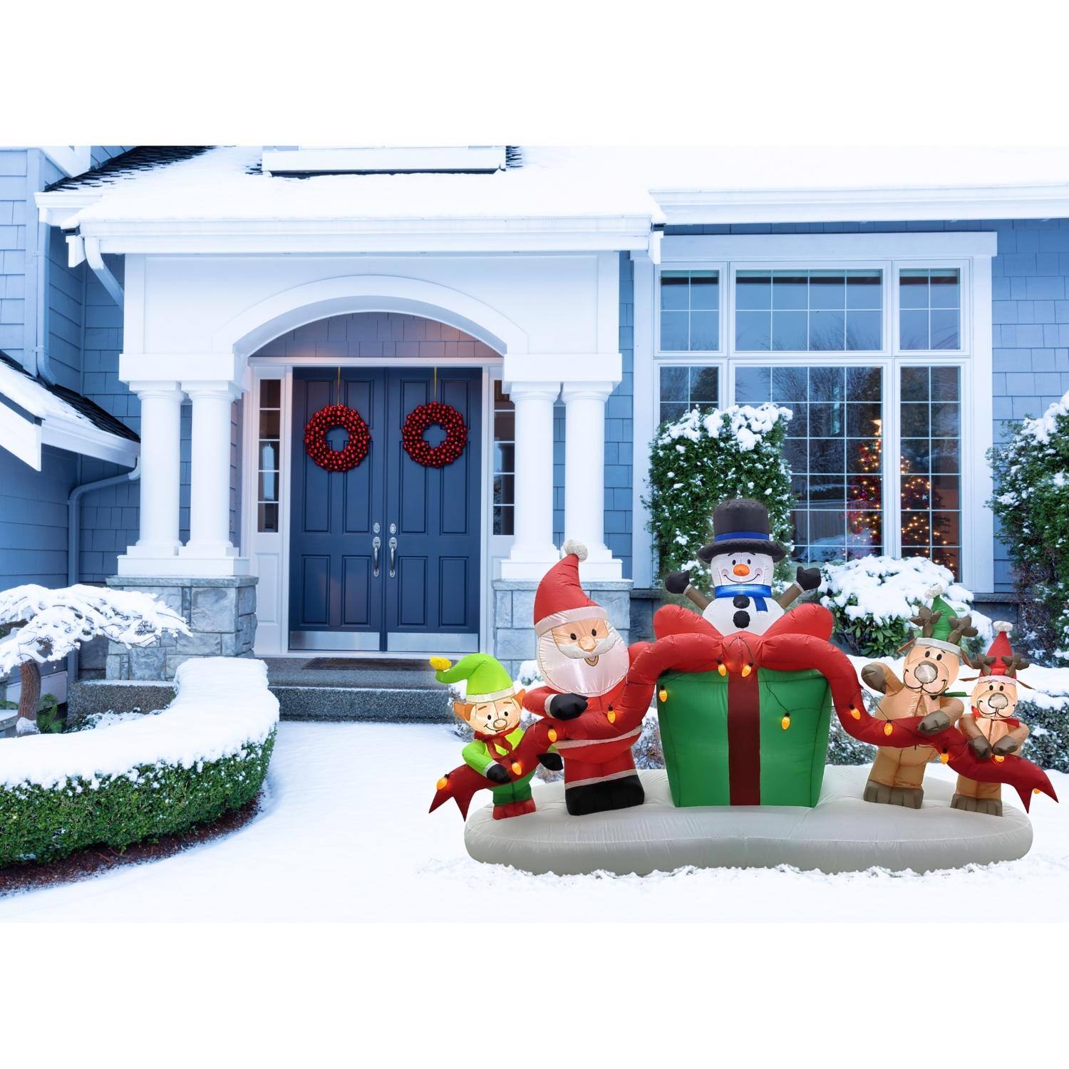 Left. Celebrations - Celebrations Santa with Elf, Snowman, Deer and Presents 8 ft. Inflatable - Multicolored.