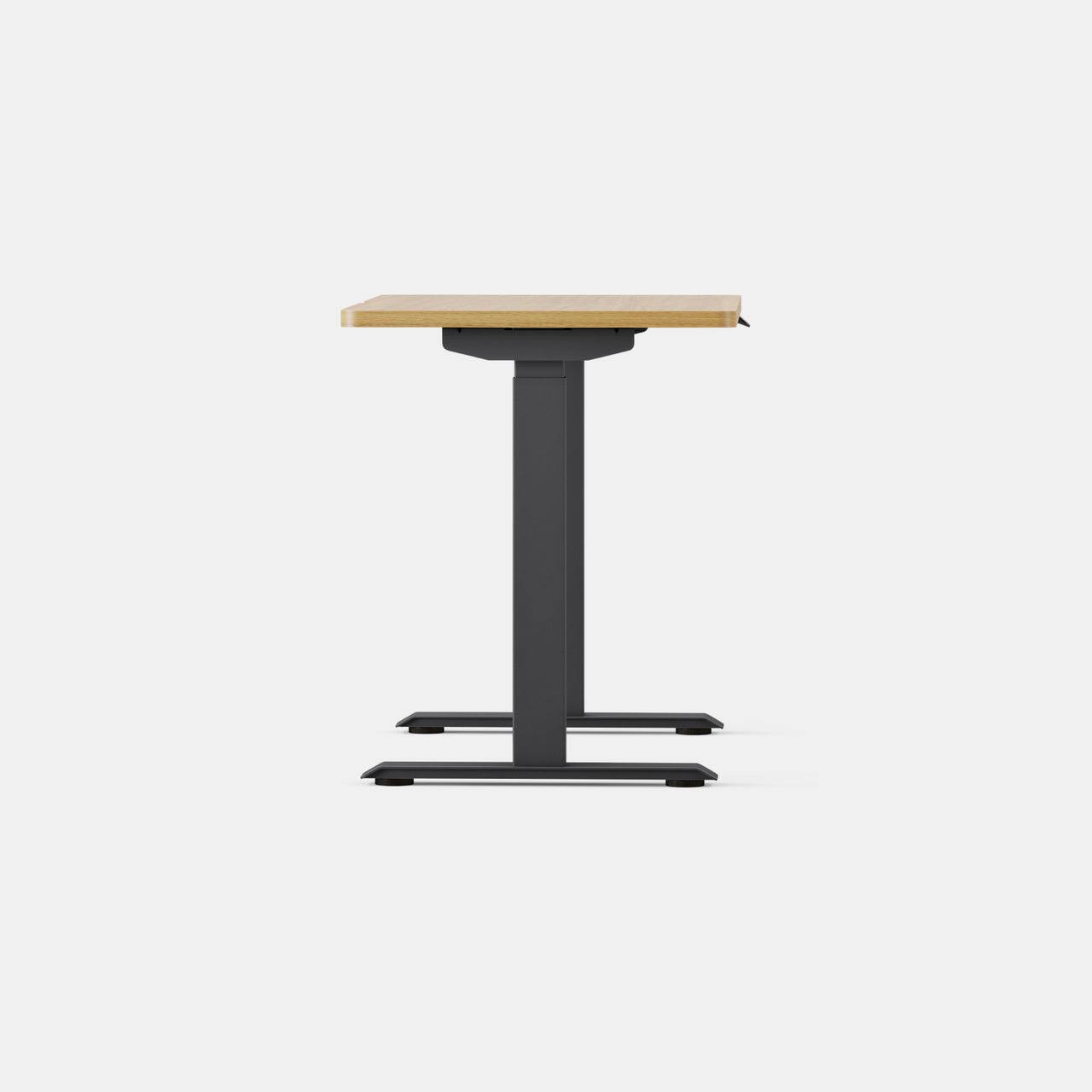 Angle. Branch Furniture - Duo Standing Desk 36" – Adjustable Desk with OLED Control Panel, Frameless Design & Compact Footprint - Woodgrain / Charcoal.