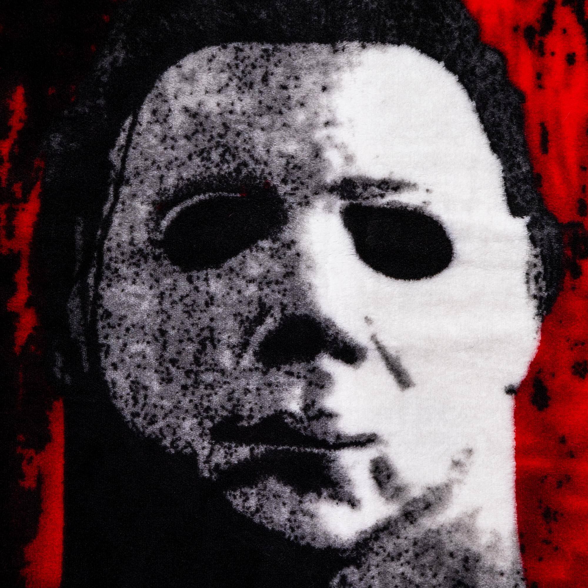 Alt View 1. Silver Buffalo - Halloween II "The Faces Of Michael Myers" Raschel Throw Blanket | 45 x 60 Inches - Multi-Colored.