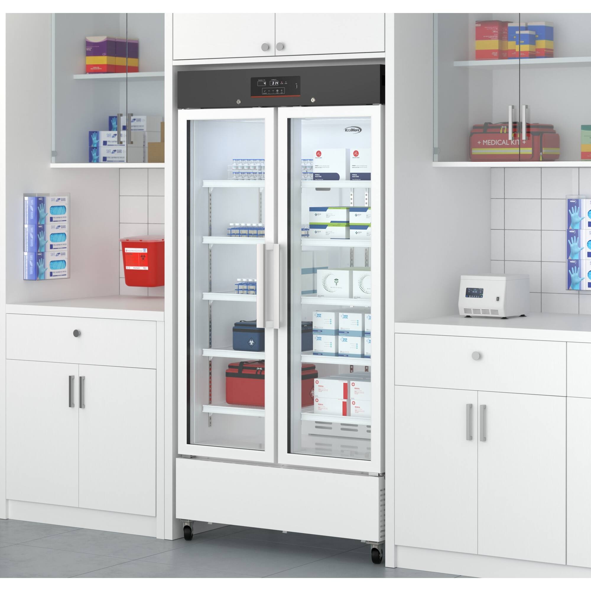 The image shows a refrigerator in a medical setting, with the door open and revealing a variety of medications stored inside. The refrigerator is filled with many bottles, likely containing medications, and is placed in a room with white walls. The refrigerator is located next to a counter, and there is a clock on the wall above the refrigerator.