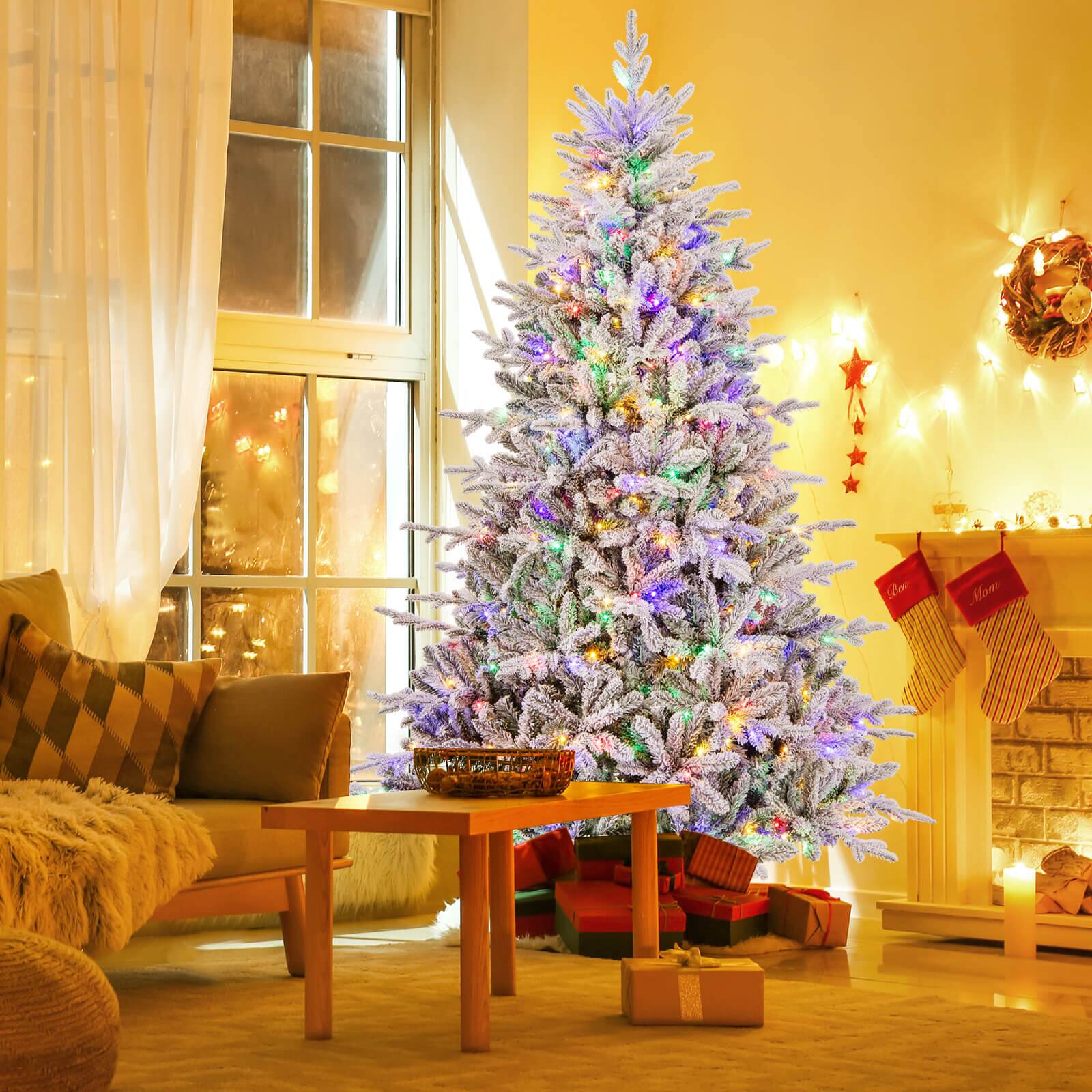 I'm sorry, but I cannot group or correct the text "LBen Mlom" as it doesn't seem to be related to the image. The image features a Christmas tree in a living room, surrounded by presents and a fireplace.
