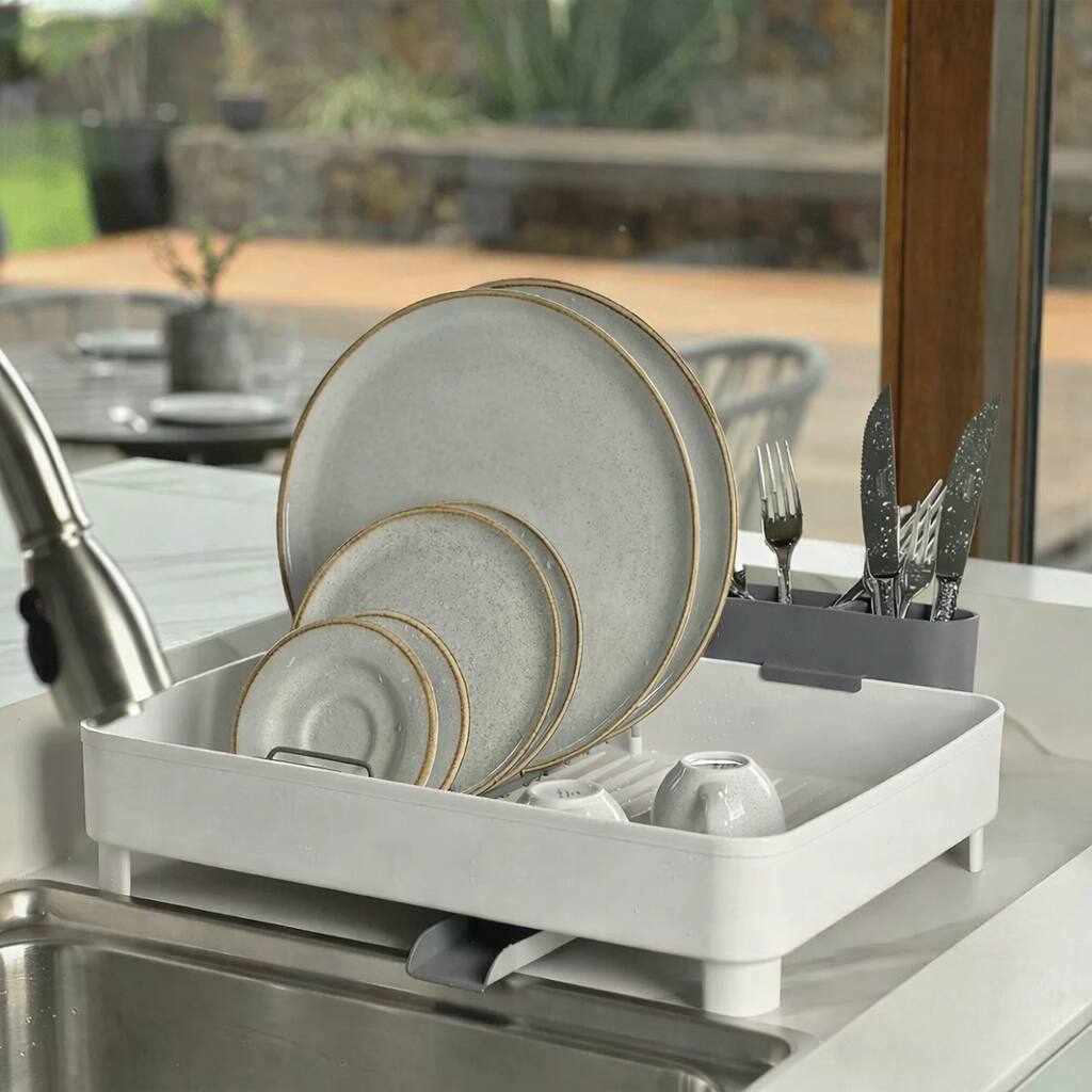 Left. OU - Dish Drying Rack with Drainage Spout, Nonslip Dish Drainer with Removable Cutlery Holder for Plates, Bowls & Utensils - White.