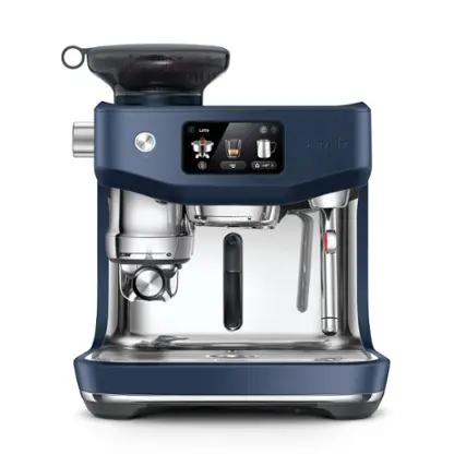 The image features a blue coffee maker, specifically a Breville coffee maker, which is a compact espresso machine. The coffee maker has a digital display and a control panel, making it easy to use and navigate. The machine is designed to make a variety of coffee drinks, including lattes, cappuccinos, and macchiatos. The blue color of the coffee maker adds a modern and stylish touch to any kitchen or countertop.