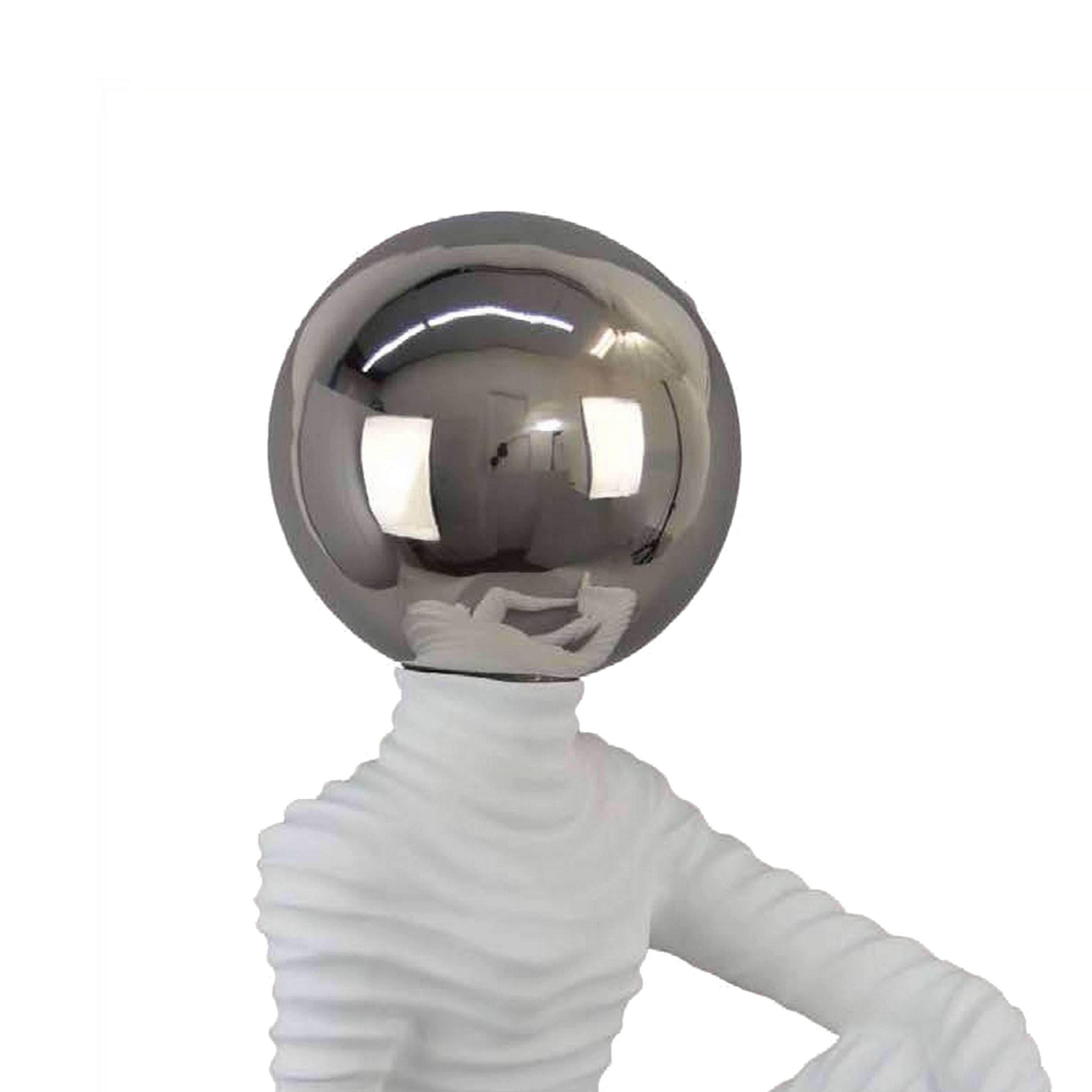 Left. Manhattan Lane - Accent Decor Statuette, 21 Inch White Ceramic, Sitting Astronaut - White.
