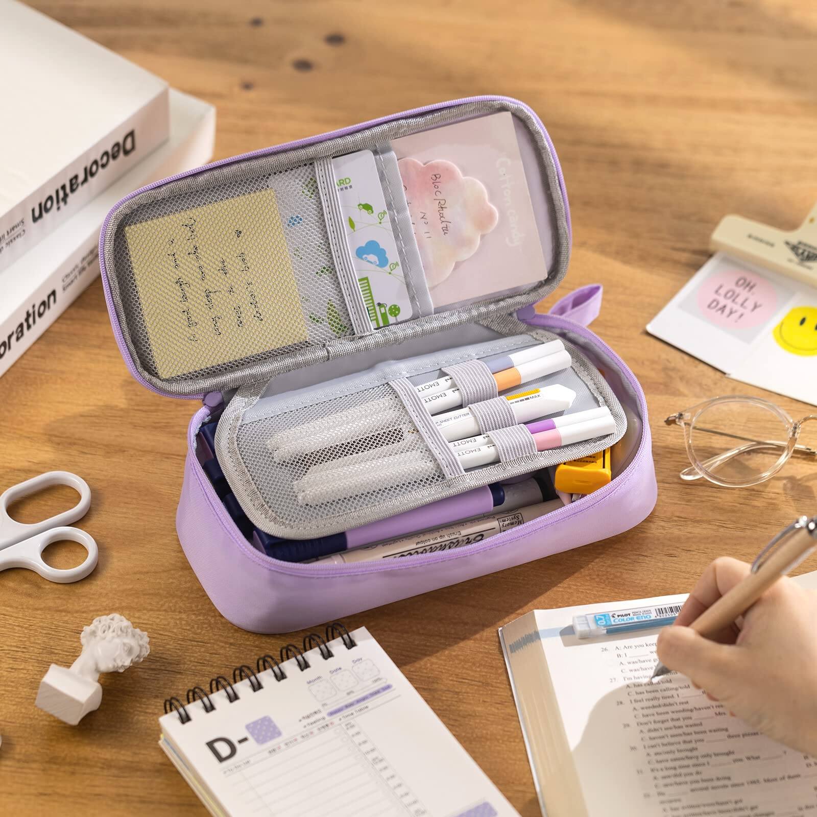 Sure, here is the corrected and grouped text from the image:

**Top Left:**
- Decoration

**Top Center:**
- Lwg Decoration

**Top Right:**
- OH LOLLY DAY!

**Middle Left:**
- D- (calendar page)

**Middle Center:**
- Blue Pinka
- 23/11

**Middle Right:**
- OH LOLLY DAY!

**Bottom Left:**
- D- (calendar page)

**Bottom Center:**
- (Text on the notebook page being written on, partially visible)

**Bottom Right:**
- (Text on the notebook page being written on, partially visible)

**Additional Text:**
- (Text on the cards inside the pouch, partially visible)