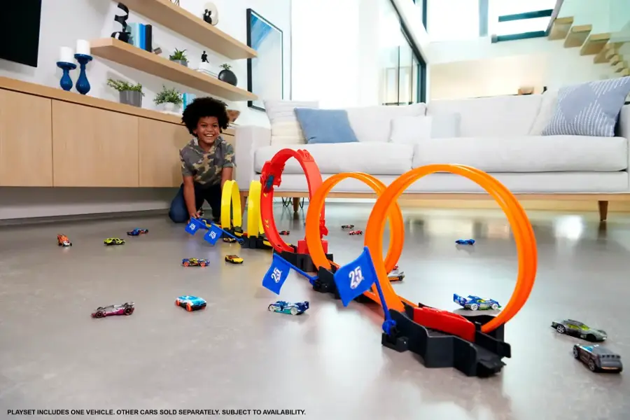 The text on the image reads: "Playset includes one vehicle. Other cars sold separately. Subject to availability."