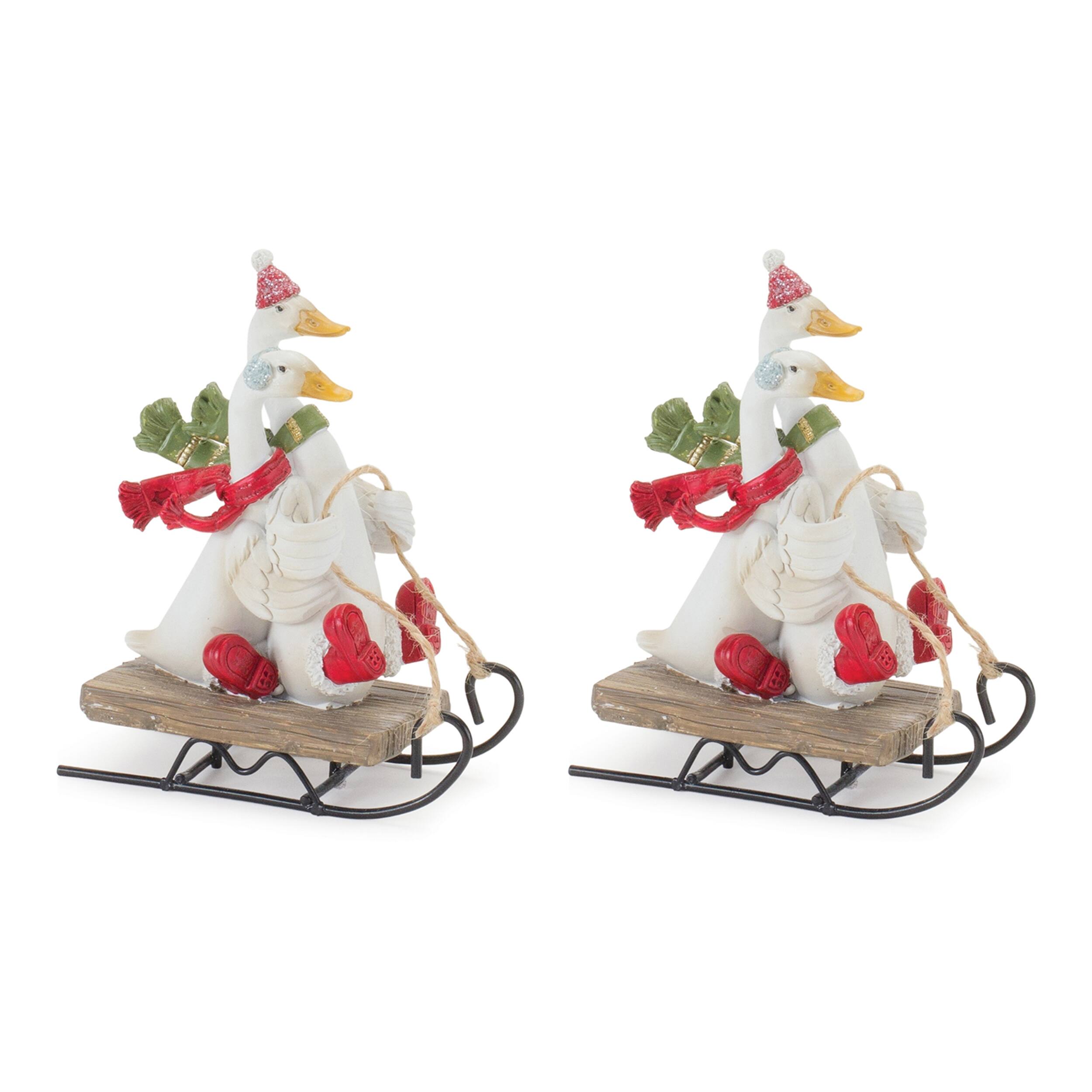Angle. BreeBe - Sledding Holiday Goose Figurine (Set of 4) - Green, White, Red.