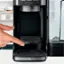 The text on the image reads "I I warm closed open clean T". However, it is not clear what the intended message is. It could be a combination of words or phrases related to coffee, such as "I like warm coffee, closed lid, open lid, clean coffee maker".