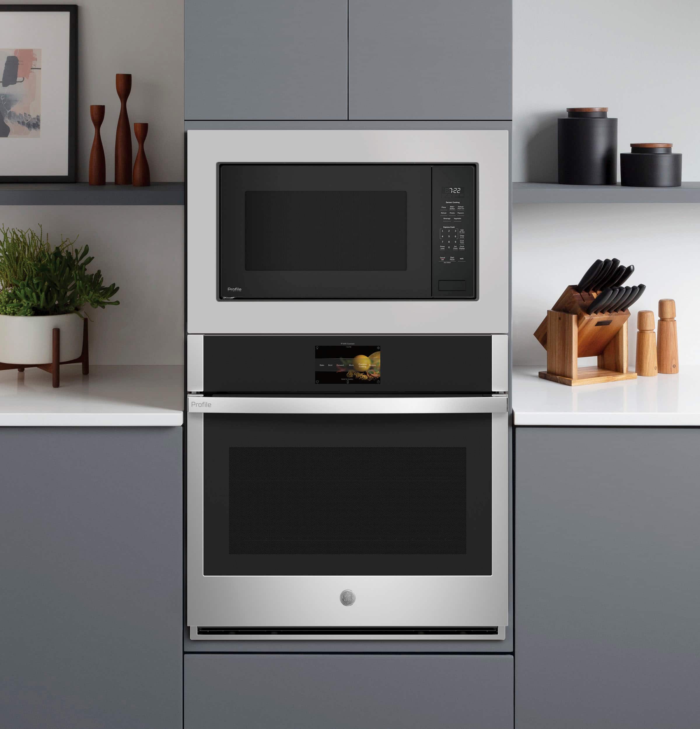 I'm sorry, but I cannot group or correct the given text as it does not appear to be related to the image of the kitchen. The image shows a stainless steel oven with a microwave above it, along with a counter and some potted plants. The text provided does not seem to have any connection to the content of the image.