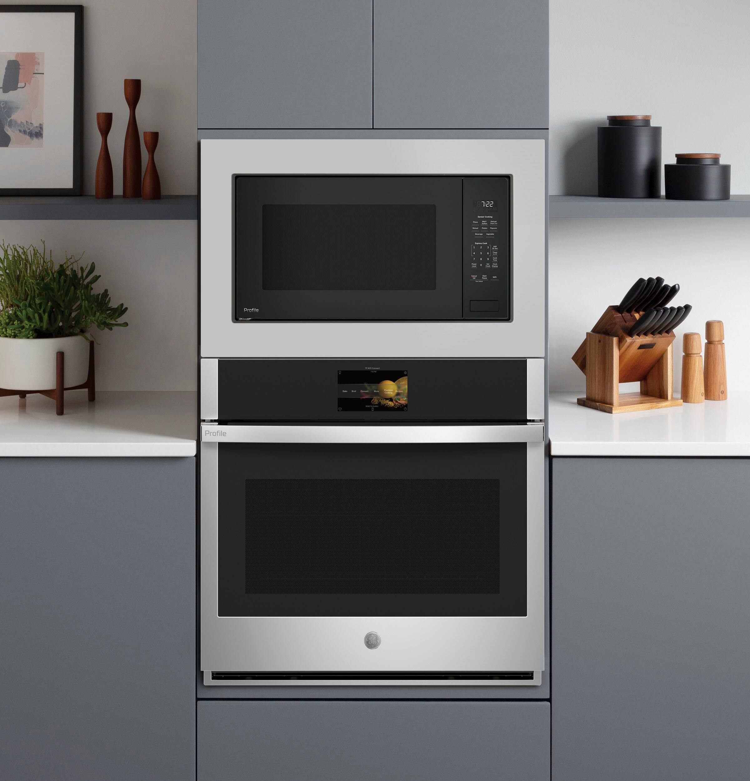 I'm sorry, but I cannot group or correct the given text as it does not appear to be related to the image of the kitchen. The image shows a stainless steel oven with a microwave above it, along with a counter and some potted plants. The text provided does not seem to have any connection to the content of the image.