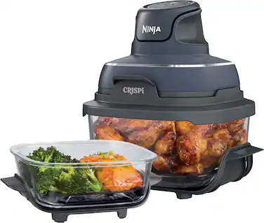 The Ninja Crisp is a versatile kitchen appliance that can be used for various cooking tasks, such as chopping, slicing, and even cooking. In the image, the Ninja Crisp is shown with a bowl of broccoli and carrots, as well as a bowl of chicken wings. The appliance is designed to make food preparation quick and easy, with its powerful motor and sharp blades. The Ninja Crisp is a convenient and efficient tool for anyone looking to save time and effort in the kitchen.