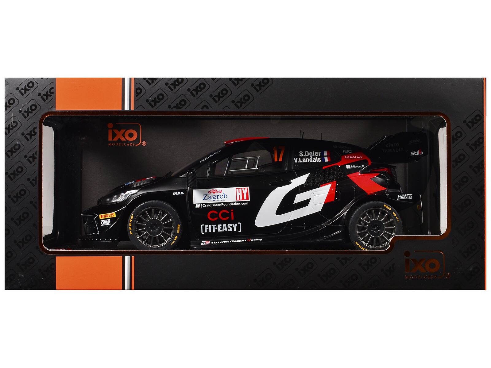 Sure, here is the corrected and grouped text from the image:

---

**Model Car Details:**

- **Brand:** iXO Modelcars
- **Car Number:** 17
- **Driver:** S. Ogier
- **Co-Driver:** V. Landais
- **Sponsors:**
  - Microsoft
  - KINTO
  - TAMADIC
  - stilo
  - PIAA
  - HY
  - Zagreb
  - CraigBreenFoundation.com
  - CCi
  - [FIT-EASY]
  - TOYOTA GAZOO Racing
  - ENDLESS
  - Pirelli
  - OMP

**Additional Text:**

- iXO
- iXO
- iXO
- iXO
- iXO
- iXO
- iXO
- iXO
- iXO
- iXO
- iXO
- iXO
- iXO
- iXO
- iXO
- iXO
- iXO
- iXO
- iXO
- iXO
- iXO