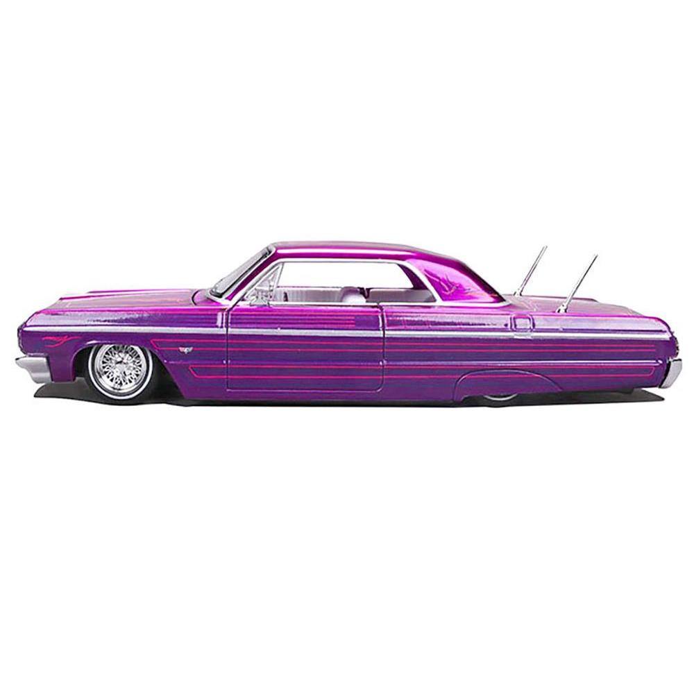 Angle. Maisto - 1964 Chevrolet Impala SS Lowrider Candy Purple with Graphics and White Interior "Lowriders" "Maisto Design" Series 1/26 - Purple.