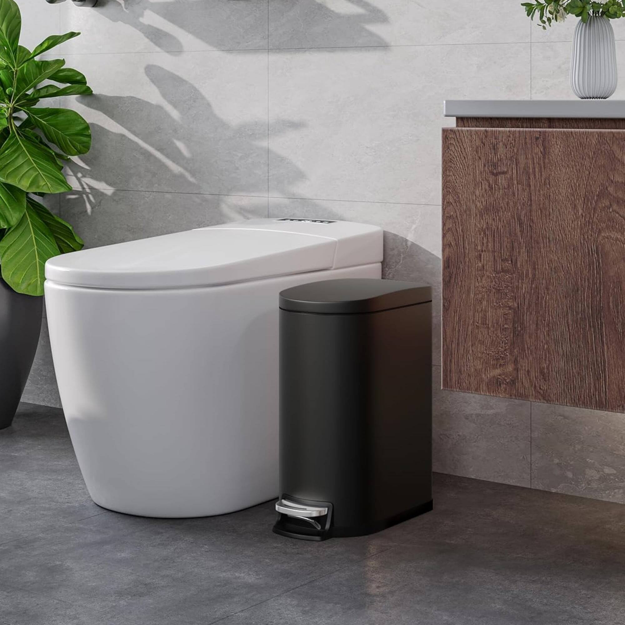 Left. Homhougo - 2.6 Gallon Step-on Trash Bin with Lid, 12.6 x 7.32 x 15.28", Bathroom Use, Black - Black.